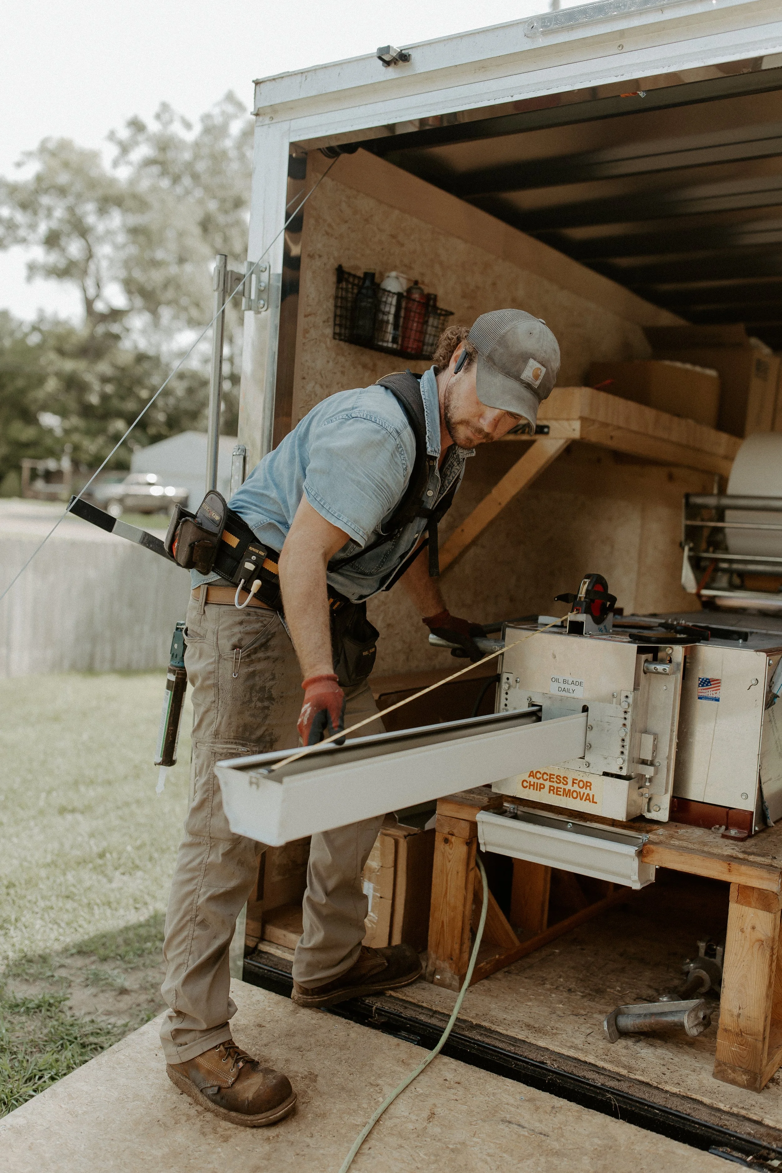 Oranssi carpenter using bench saw