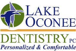 Logo for Lake Oconee Dentistry featuring a dolphin and a stylized tooth.
