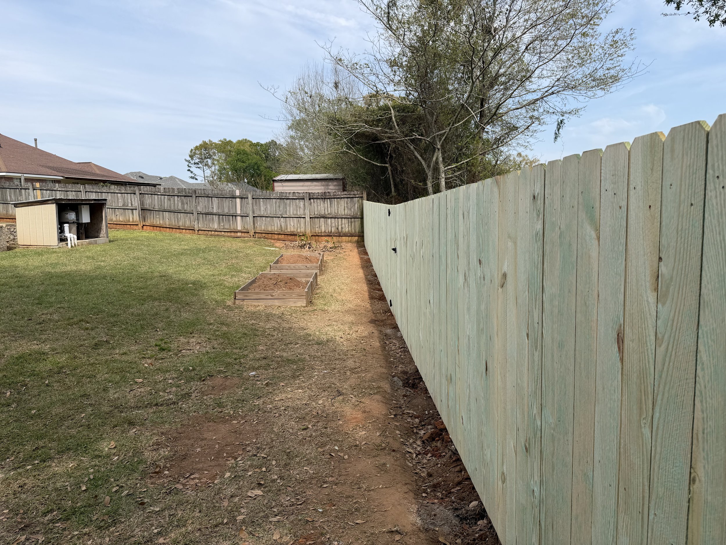 A newly installed fence by Noah's Hammer in Mobile Alabama.