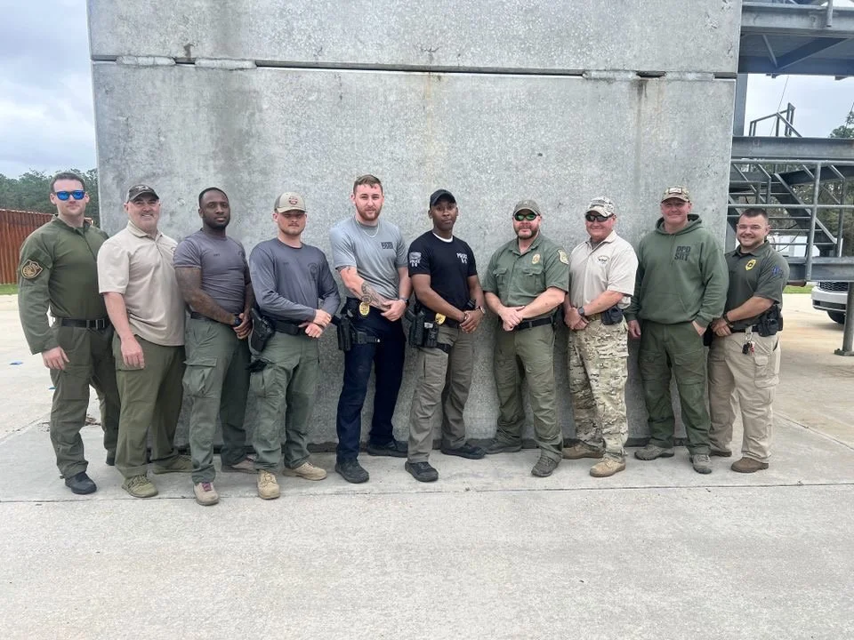 The Founder of Noah's Hammer with a group of law enforcement personnel posing for a class photo after the completion of a SWAT training class.