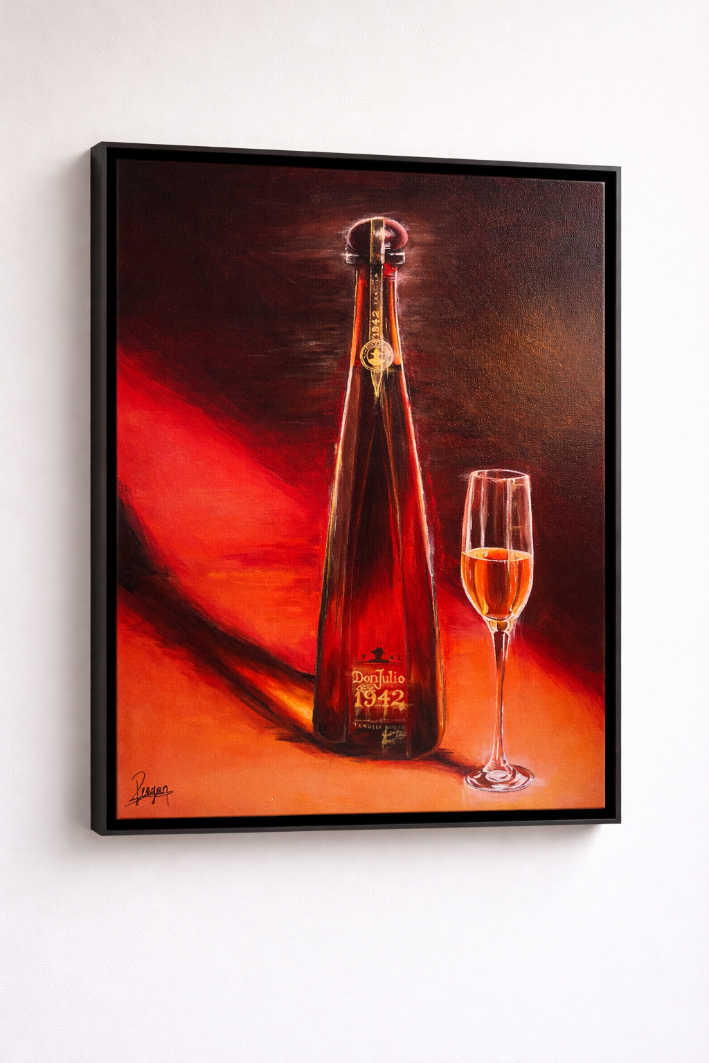 Painting of a large tequila bottle labeled Don Julio 1942 next to a filled champagne flute, on a red and orange background.