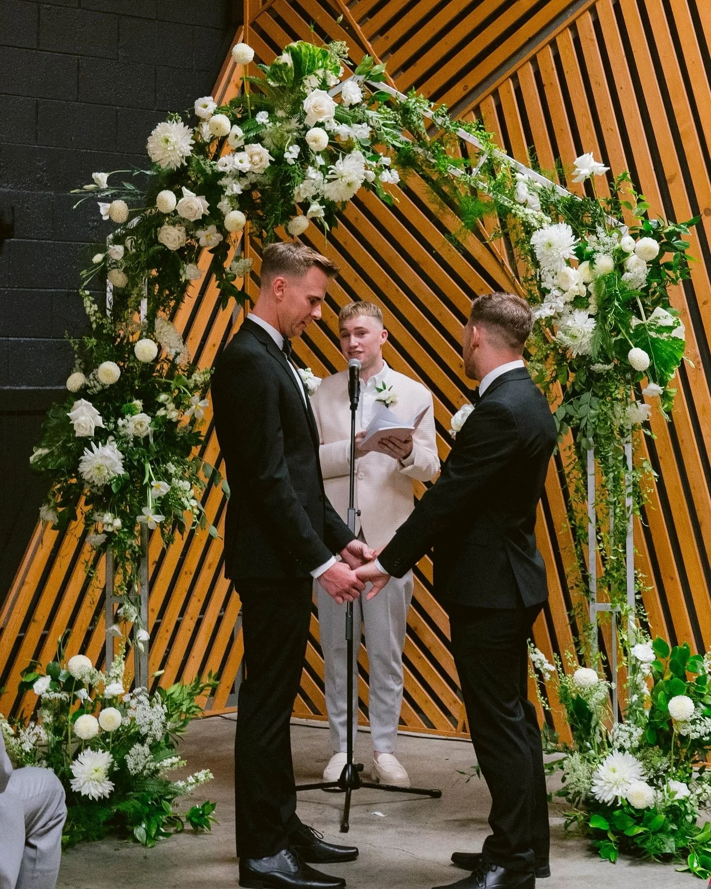I&rsquo;m not convinced this wood slat wall will be around forever, but I&rsquo;ll put my money on Nick and Chase being together forever. 🤍 

Congratulations!! 

Planner @sosmittenevents 
Photos @patrickquezada 
F&amp;B @tgiscatering 
Florals @ginge