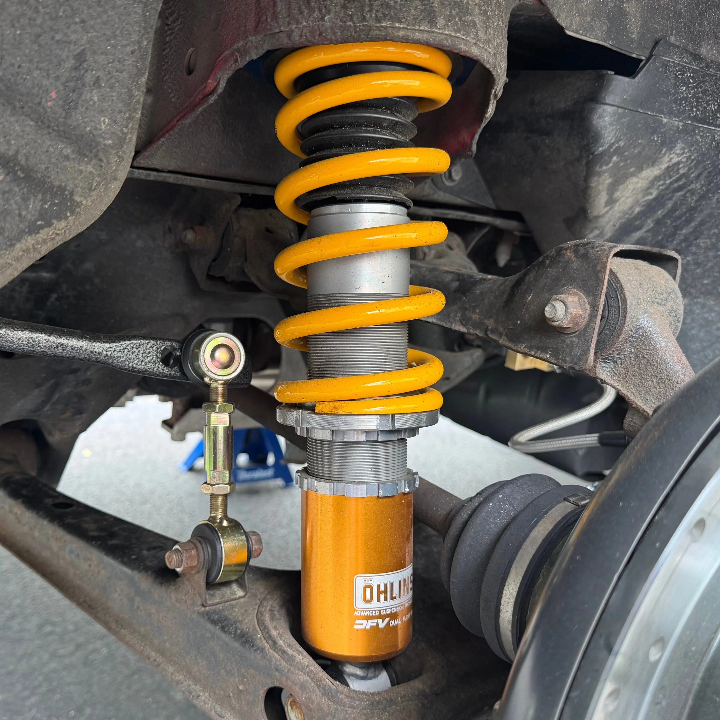 Suspension wishbones, Öhlins coilover shock, and Flying' Miata sway bar from a 1990 Mazda Miata MX-5.