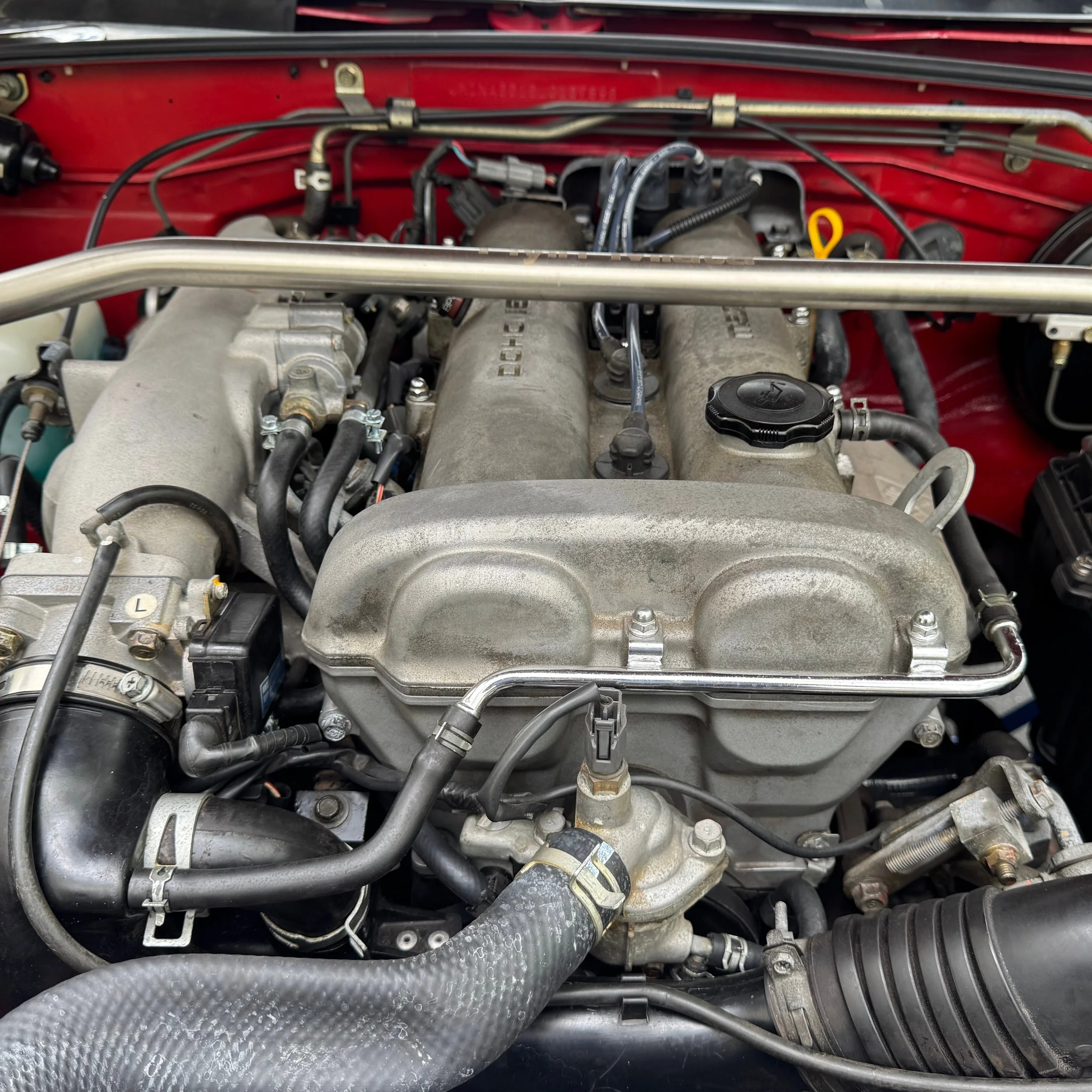 NA Mazda Miata MX-5 1.6 liter engine and Flyin' Miata shock tower brace