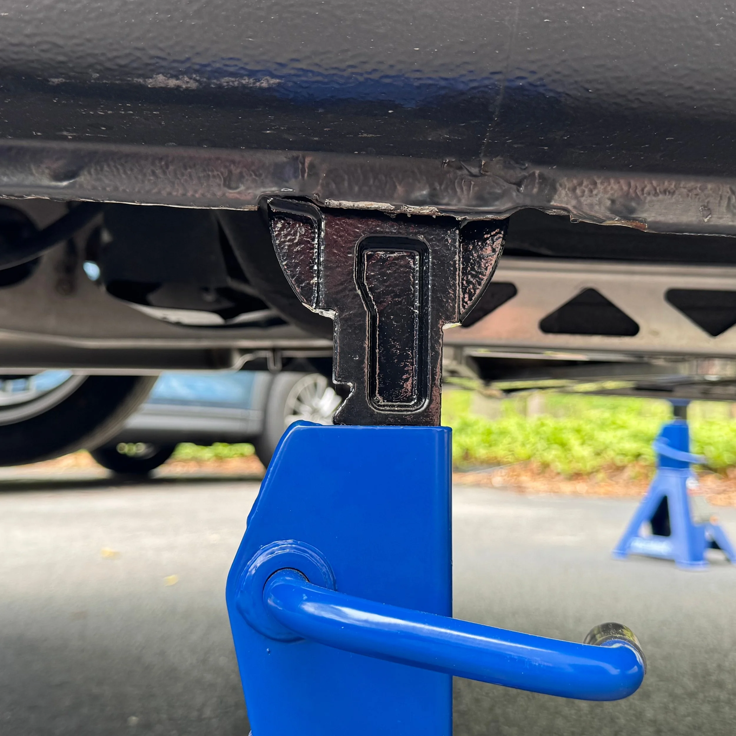 NB Mazda Miata MX-5 pinch weld and jack stand on a home driveway