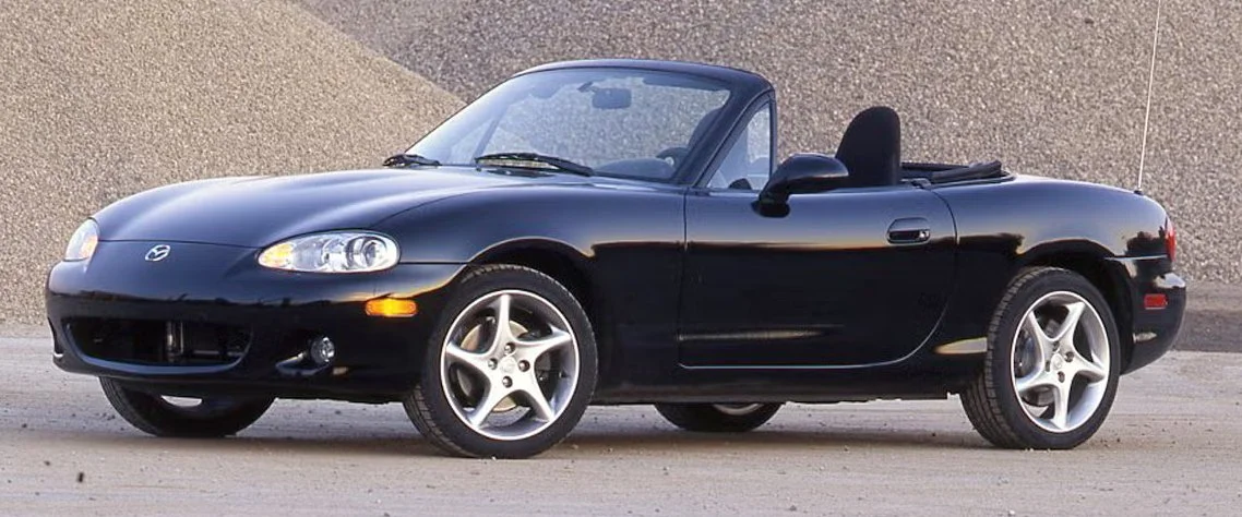 Brilliant black 2001 NB Mazda Miata MX-5. Link leads to the NB section of website.
