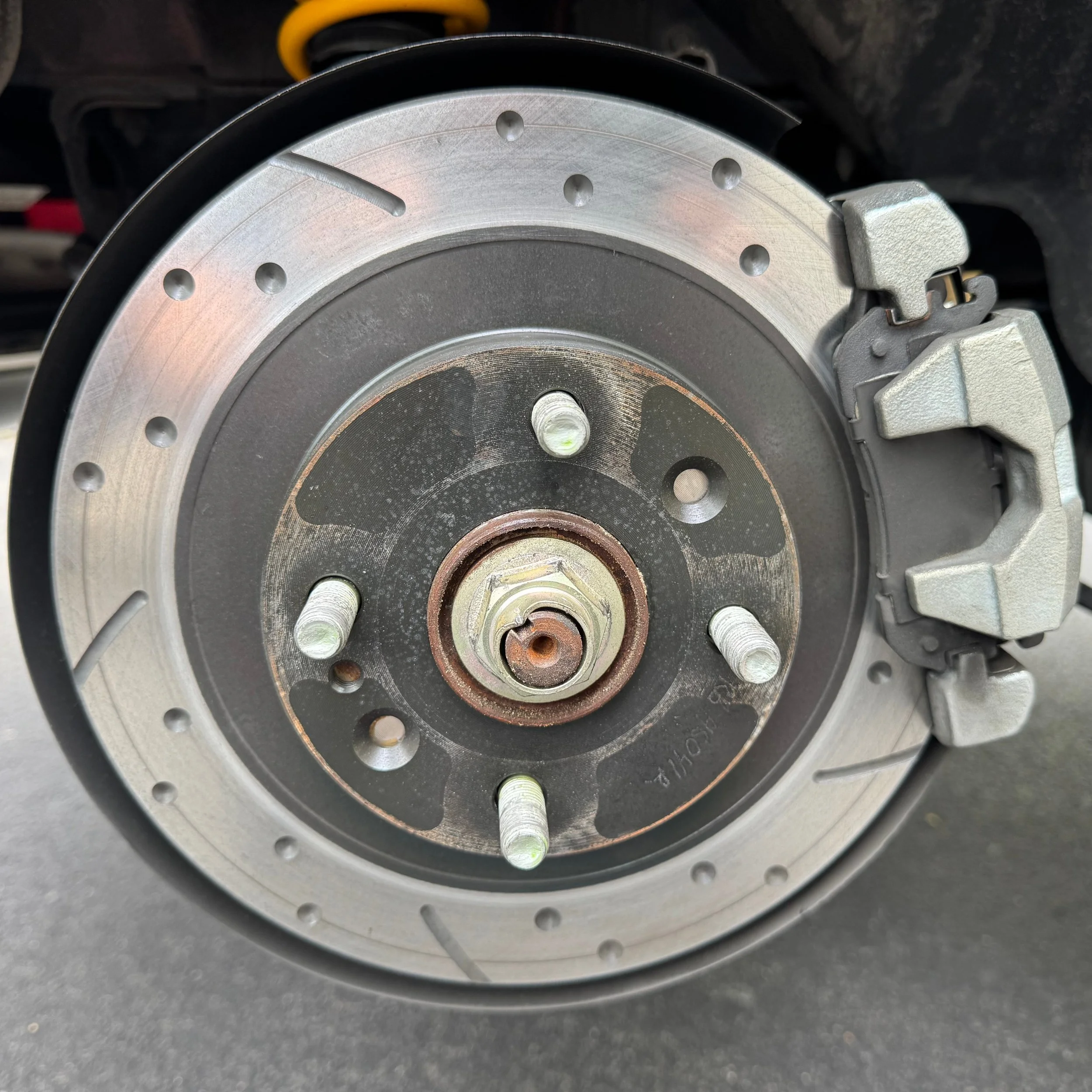 NA Mazda Miata MX-5 rear brake rotor and brake caliper