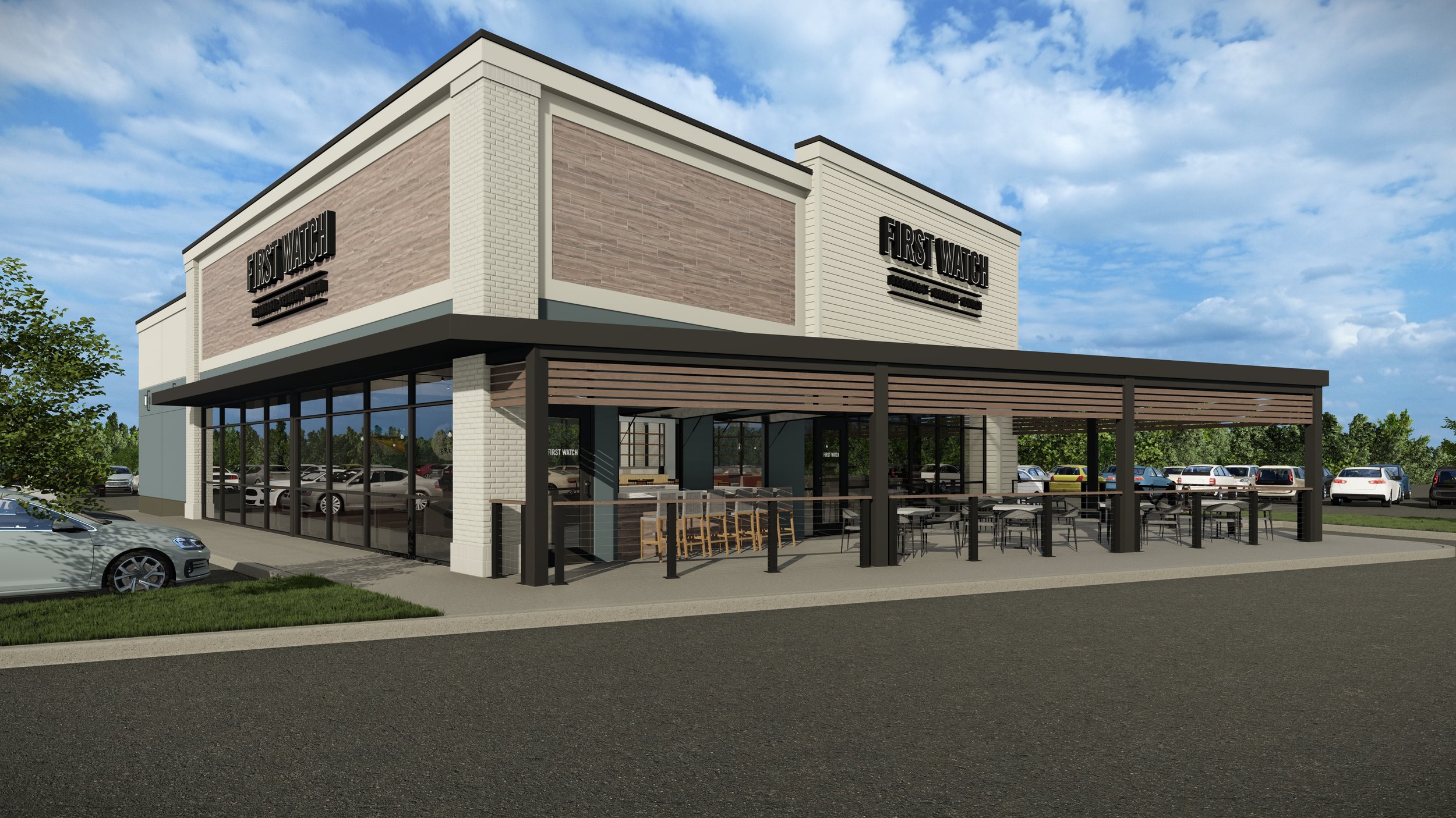 Exterior view of a modern First Watch restaurant with outdoor seating and parking lot, under a partly cloudy sky.