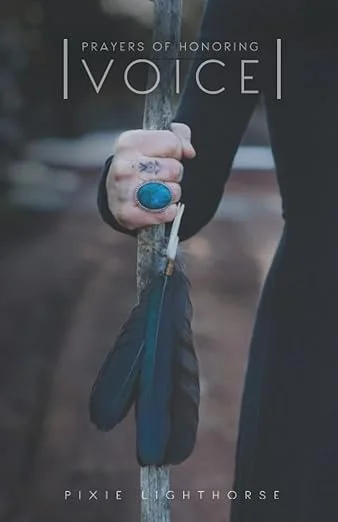 Close-up of a person holding a wooden staff, wearing a ring with a blue stone, with the text 'Prayers of Honoring Voice' and 'Pixie Lighthorse' overlaid.
