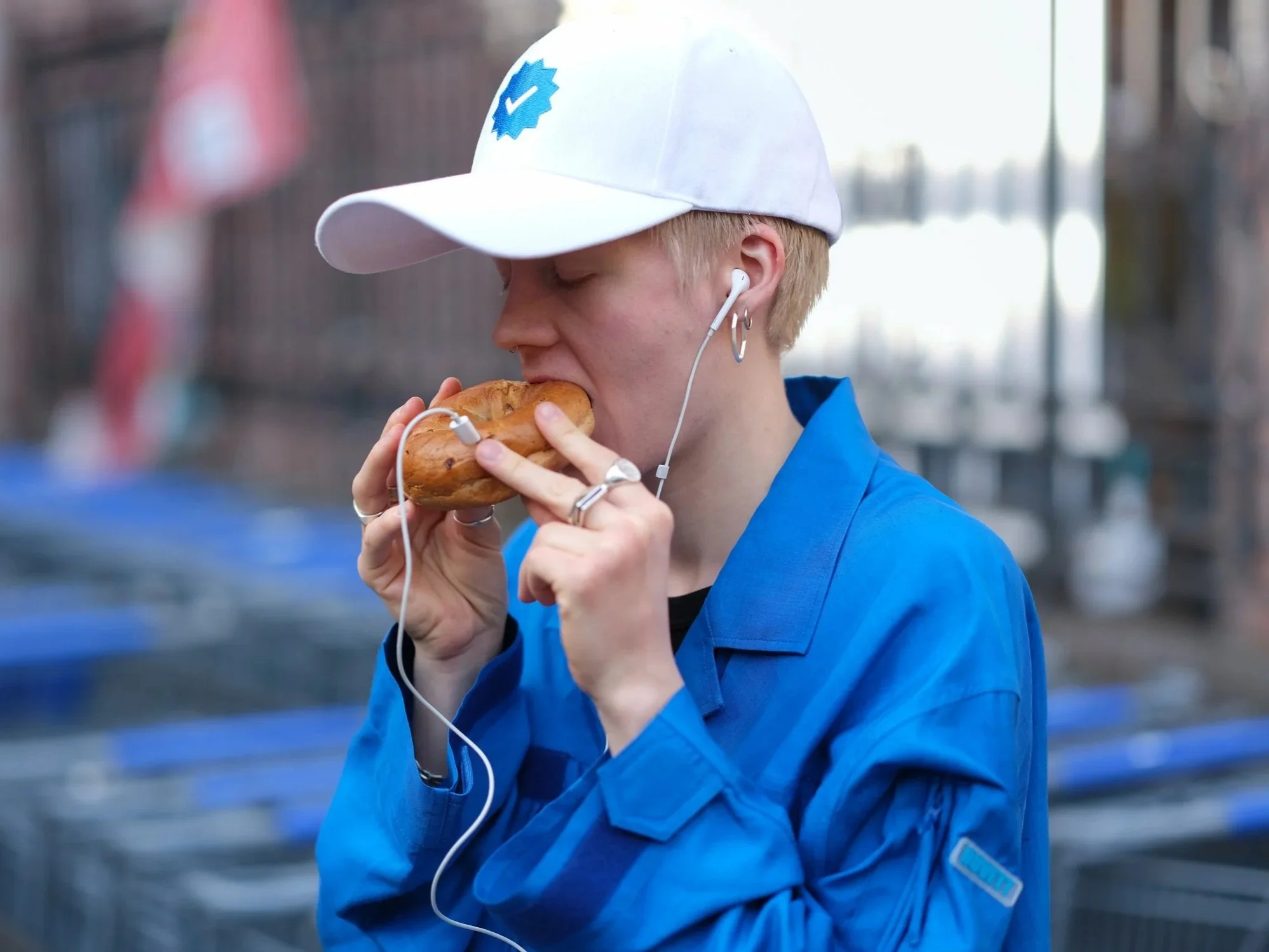 DUVETT white cap and blue jacket styling, casual streetwear look with headphones