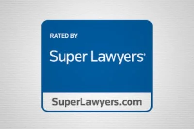 Logo of Super Lawyers with website SuperLawyers.com on a blue and white background.