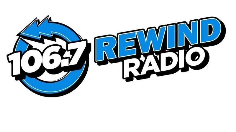 Logo for Rewind Radio featuring the station number 106.7 and a blue rewind arrow symbol.