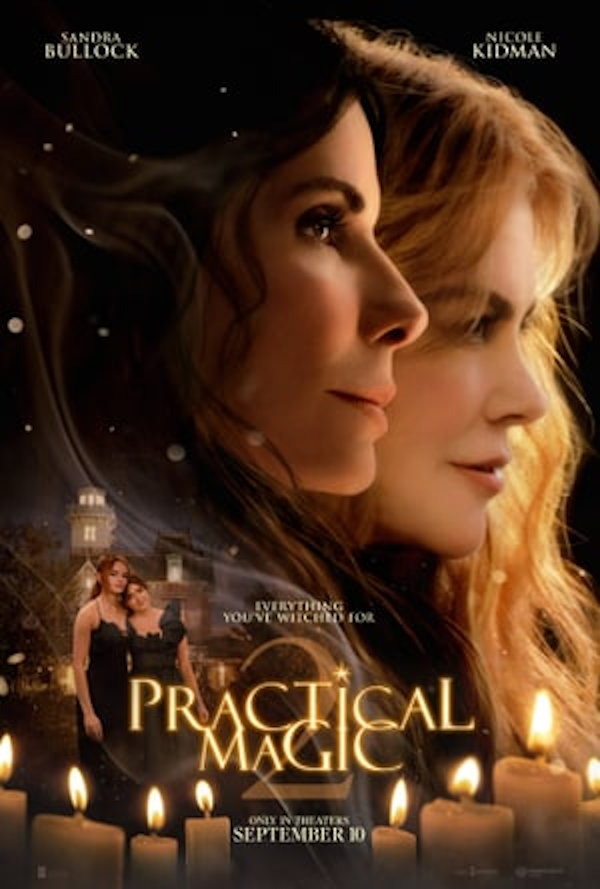 Poster of the movie "Practical Magic" showing close-up of women Sandra Bullock and Nicole Kidman with candles and a night cityscape in the background.