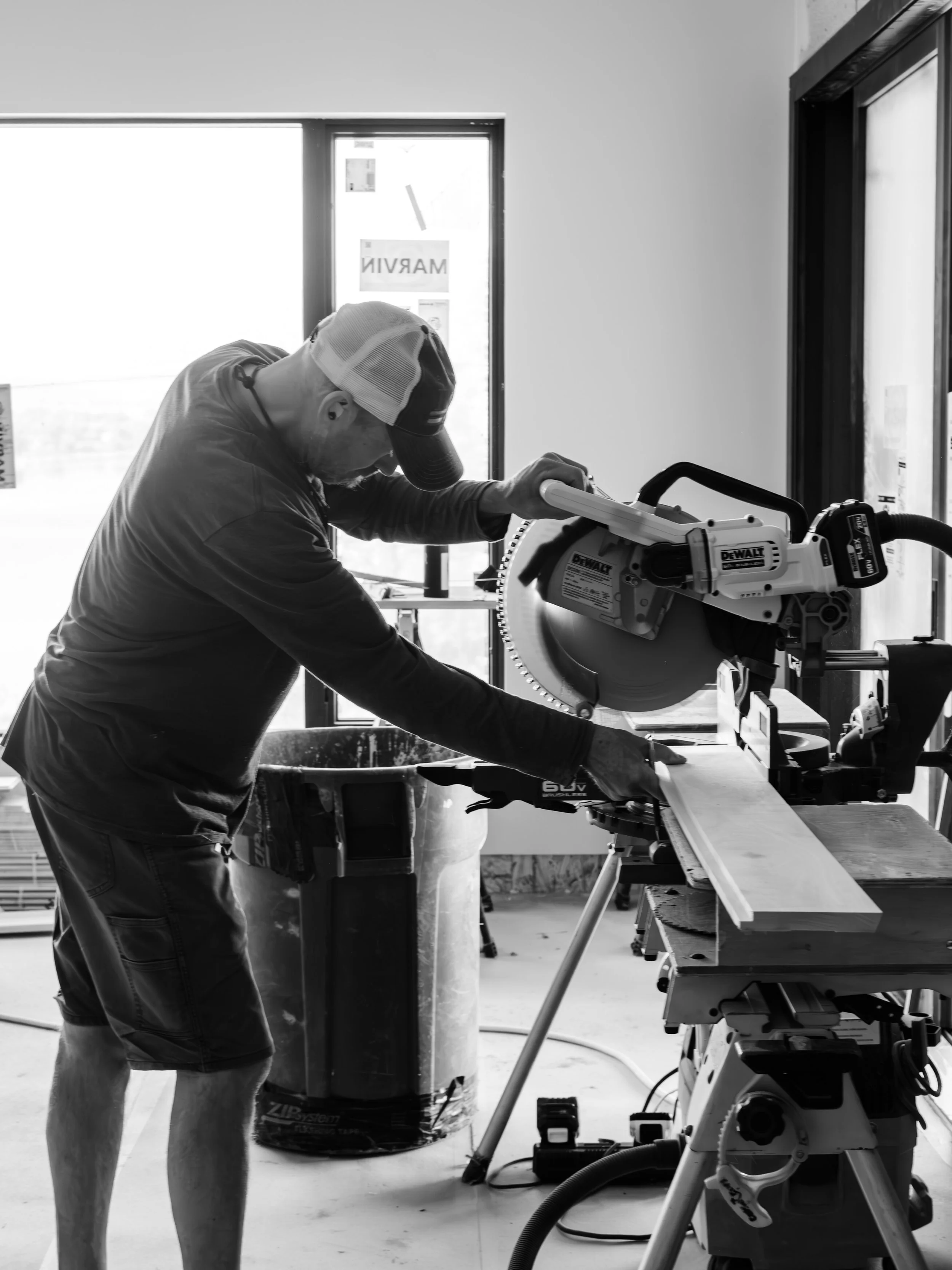 Man Cutting Wood for Custom Renovation Project