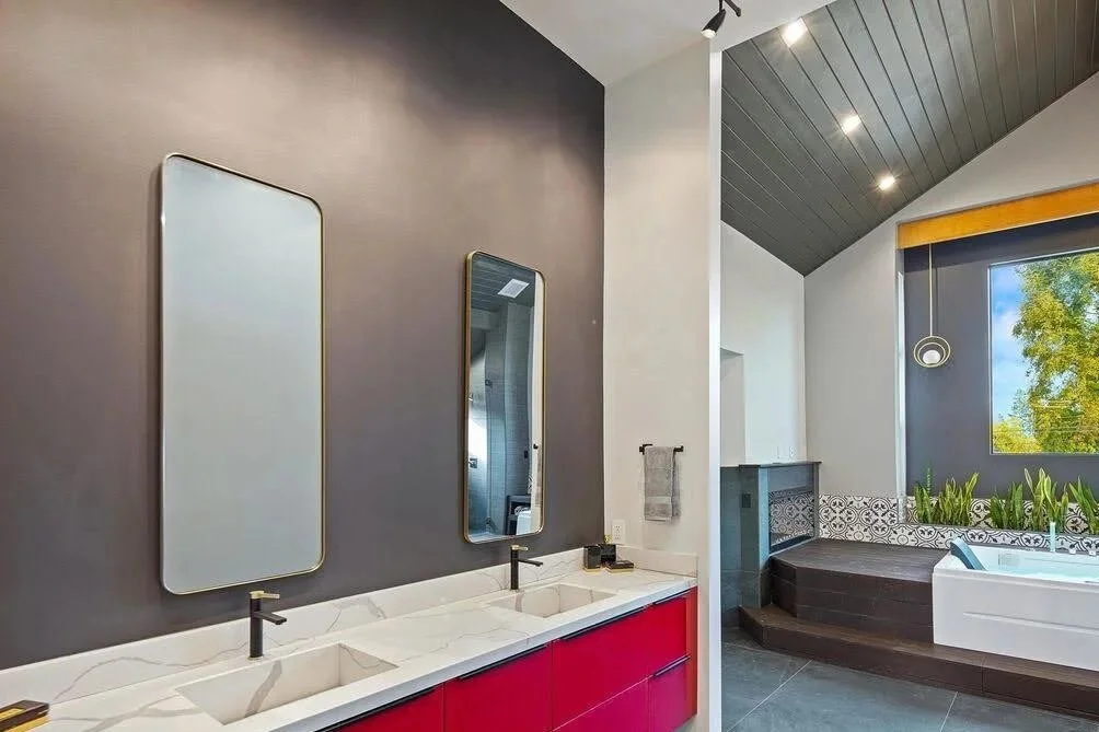 Modern red floating vanity with stone top and integrated stone sinks