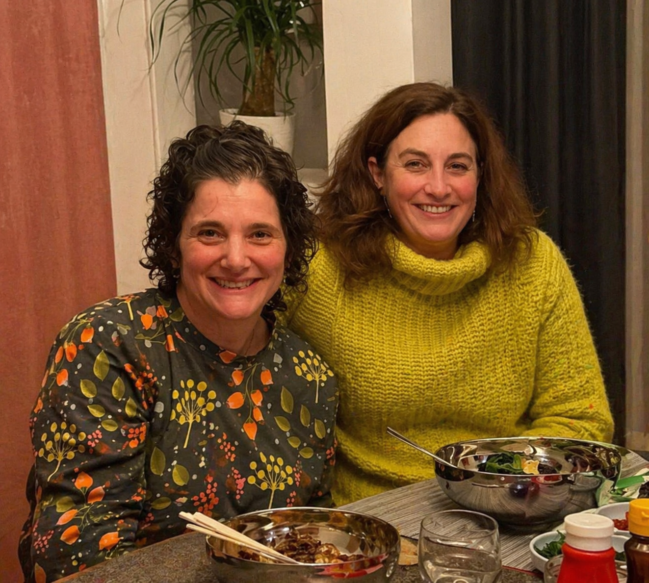 Laura S and Sarah S together at a dining table