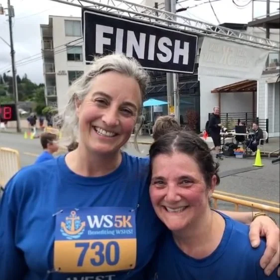 Sarah S and Laura S together at the finish line of a 5K race