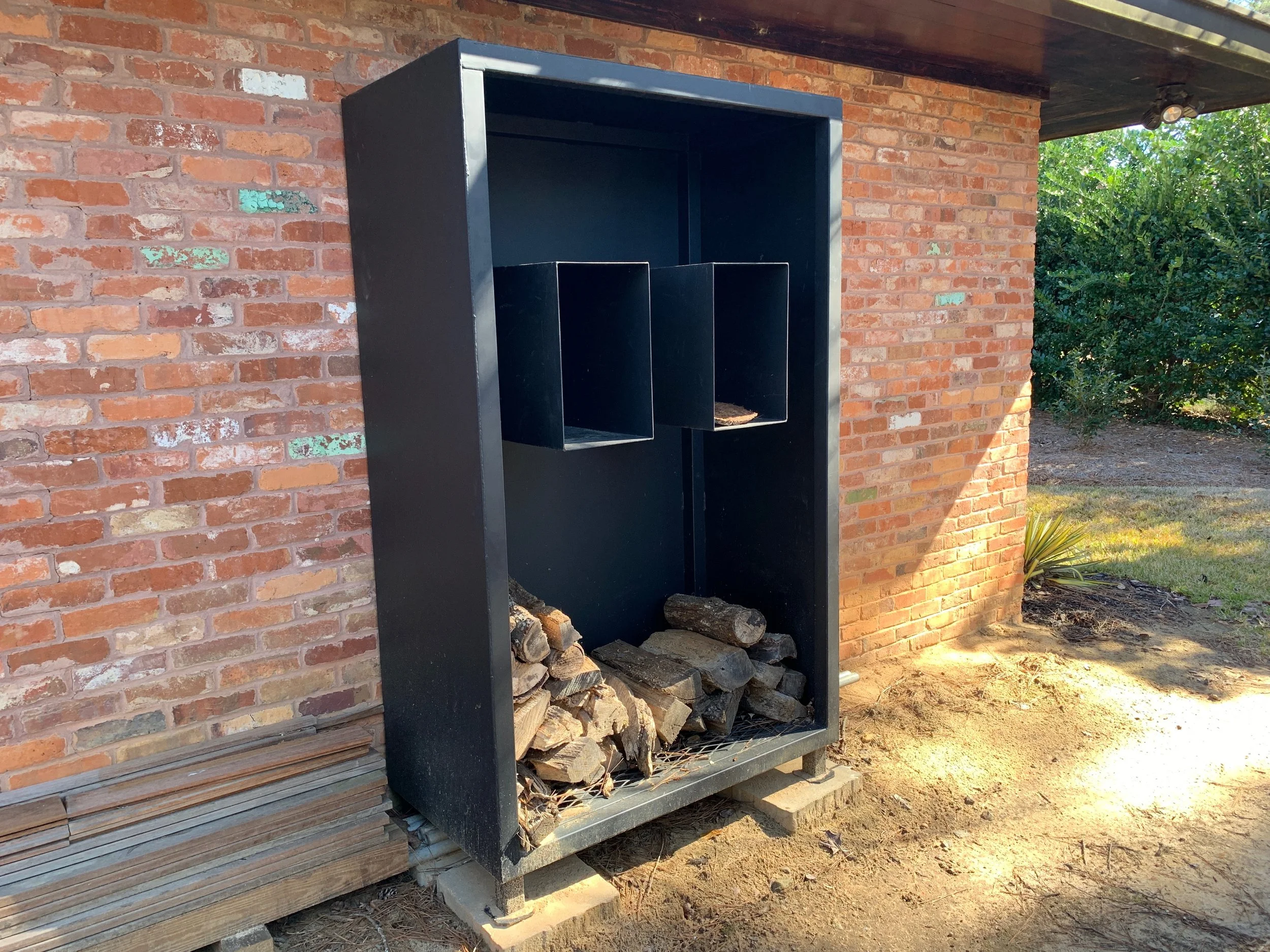 Firewood rack with integrated glove/tool shelves
