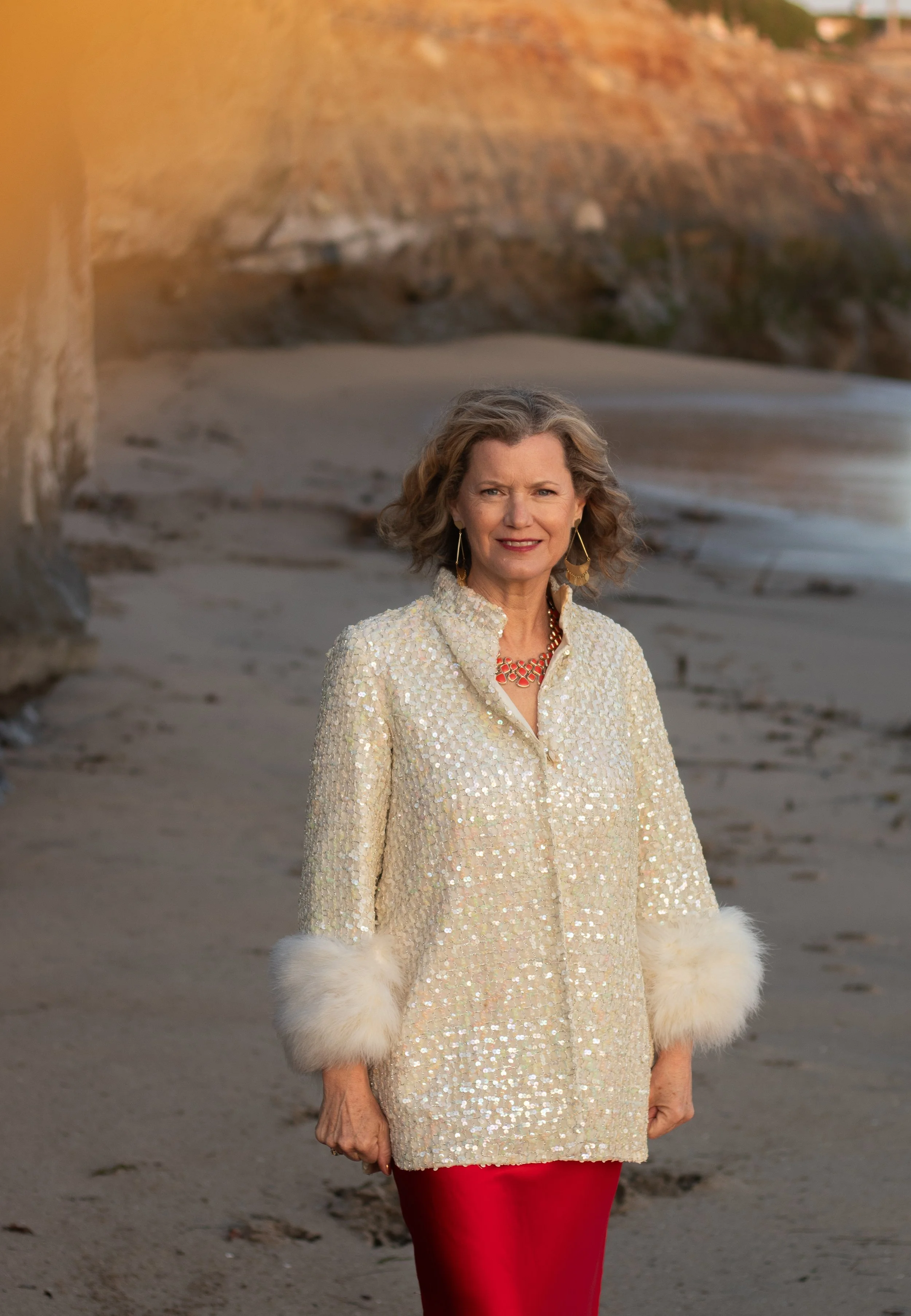 Kimberly Katherine intuitive coach and reiki practitioner walking on beach in santa cruz california representing healing and transformation