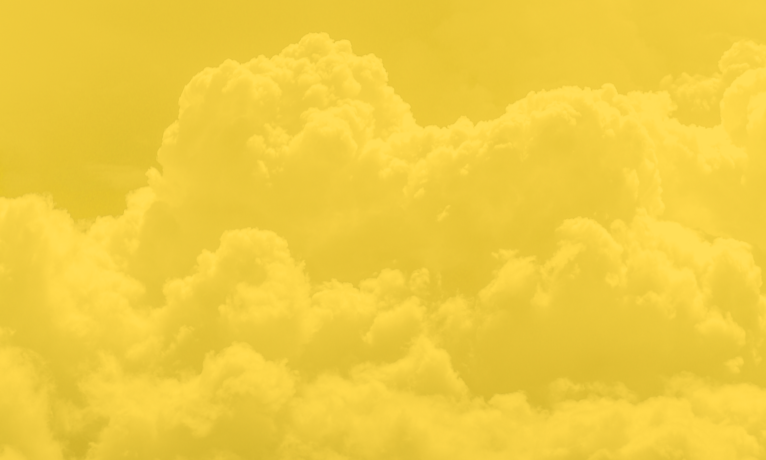 Bright yellow clouds in a sunny sky.