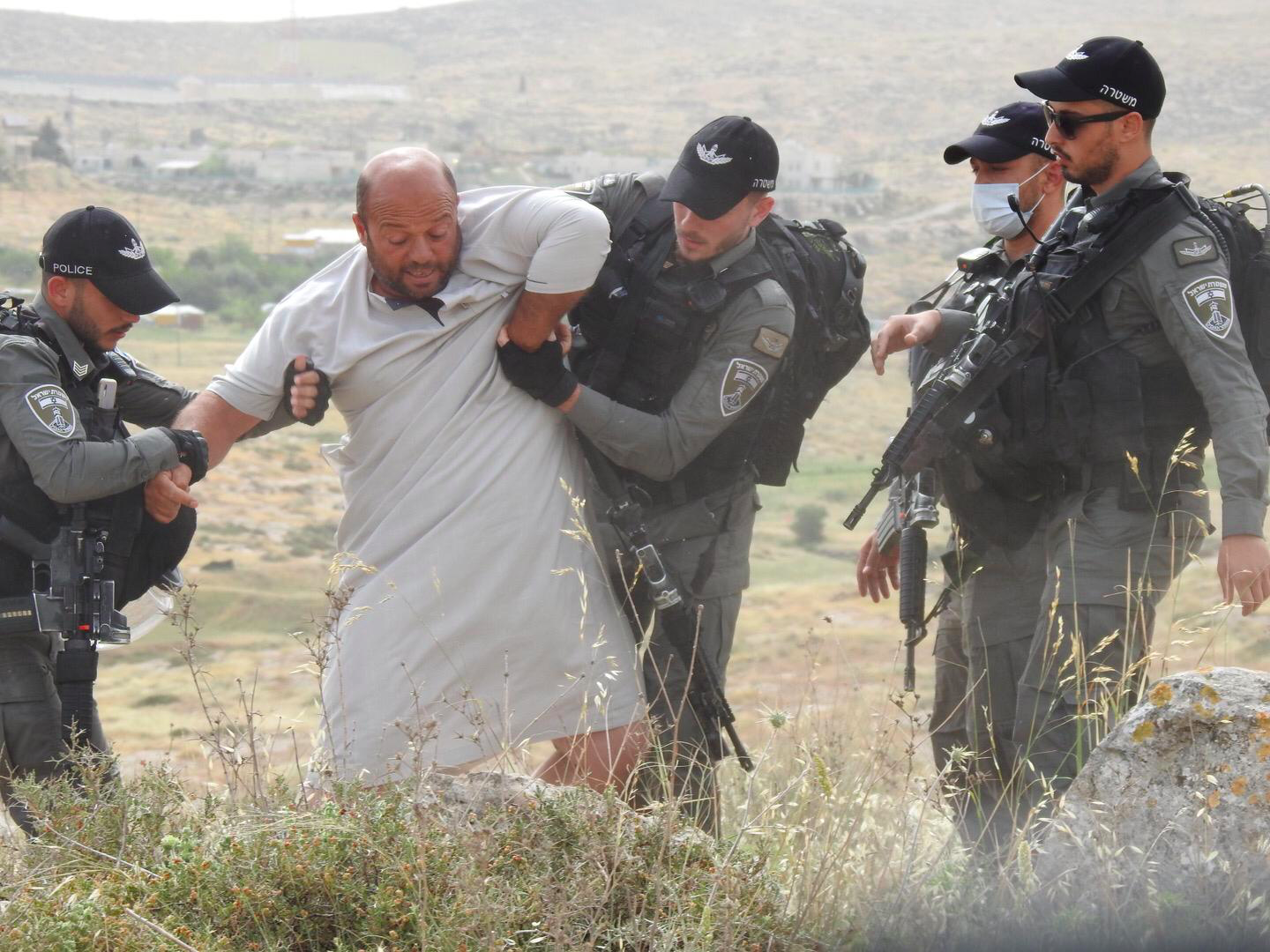 Man-being-arrested-during-demolition-Ramadan.png