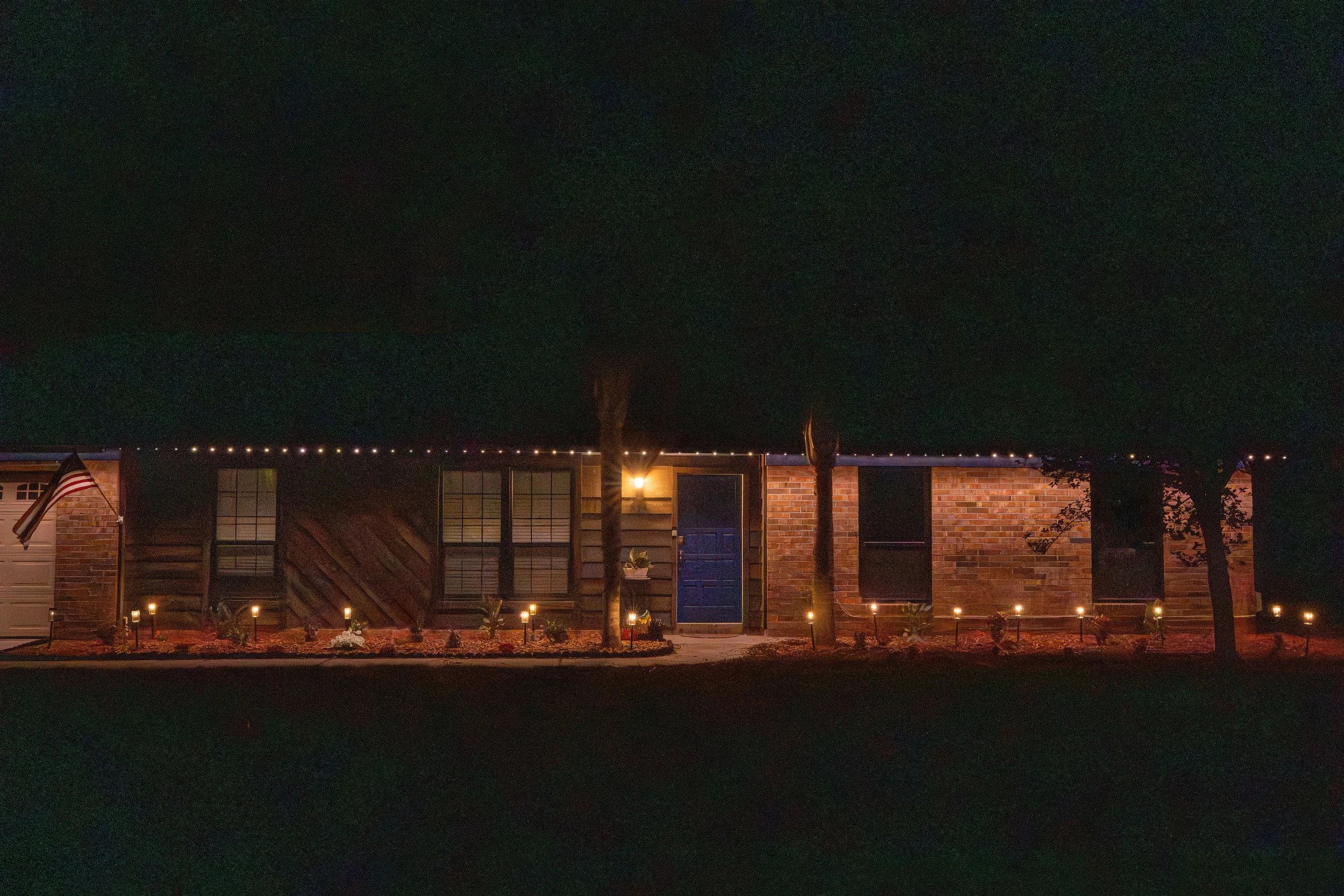 RGBW, app contolled color-changing Christmas lights mounted to roofline