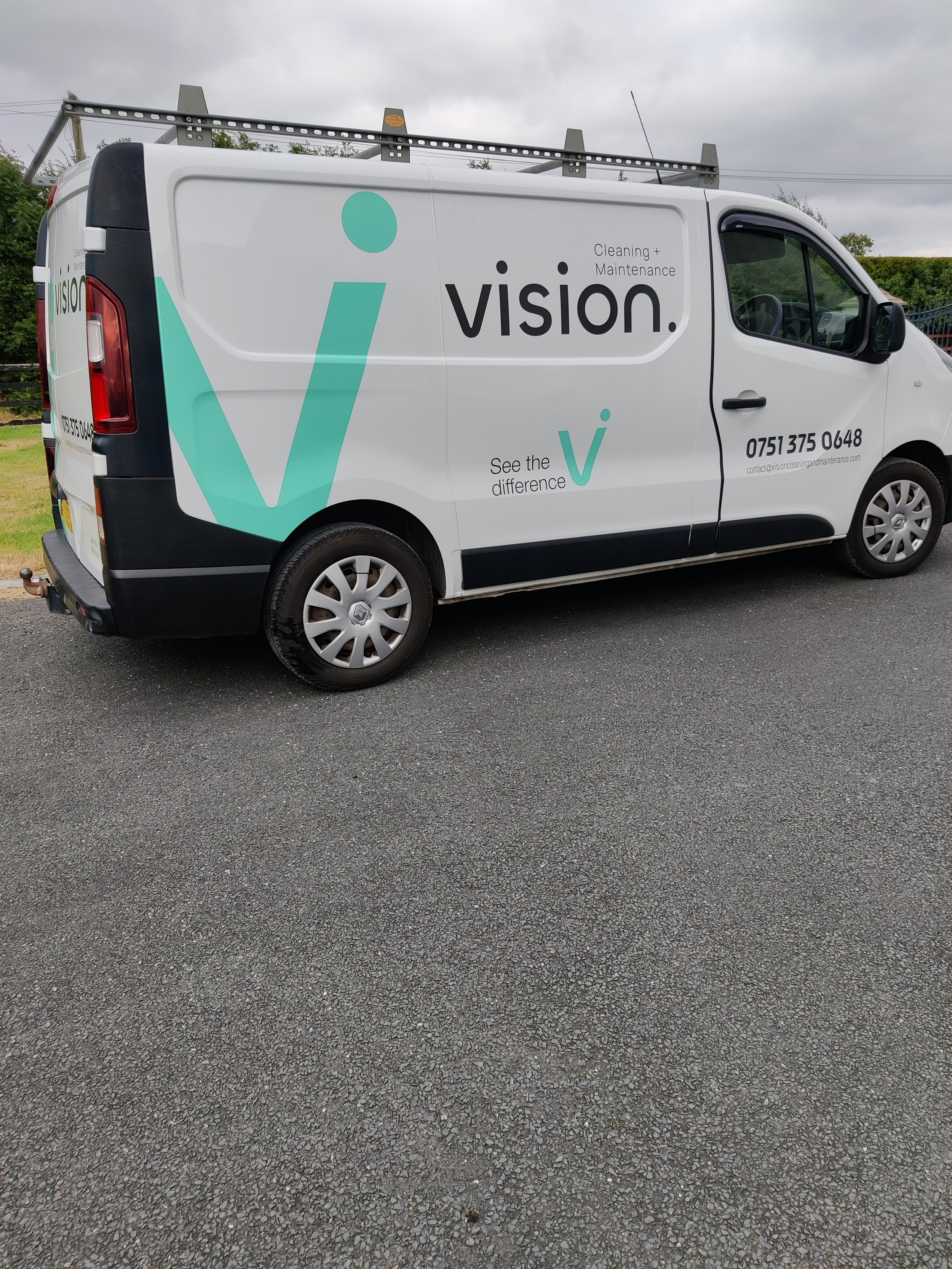 Vision cleaning and Maintenance branded van.