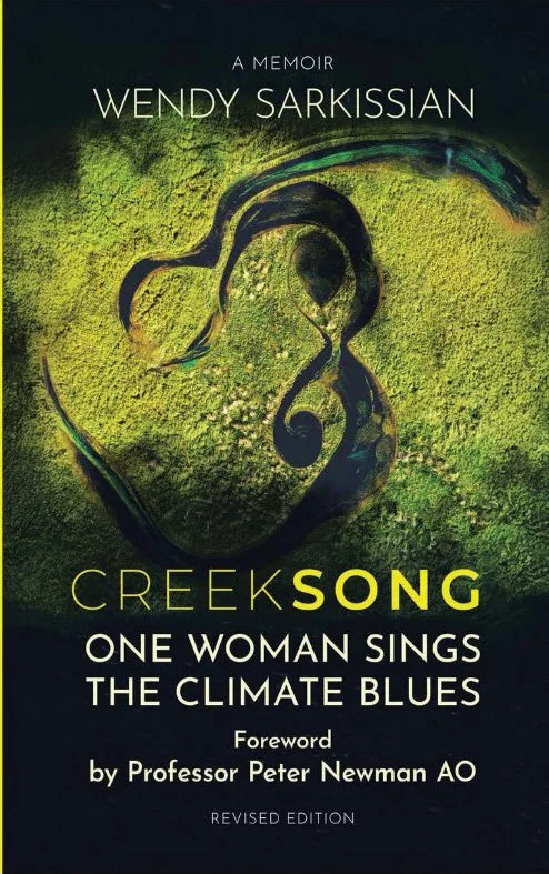 Book cover for 'Creek Song' by Wendy Sarkissian, a memoir. The cover features a musical note carved into mossy terrain with green and yellowish tones.