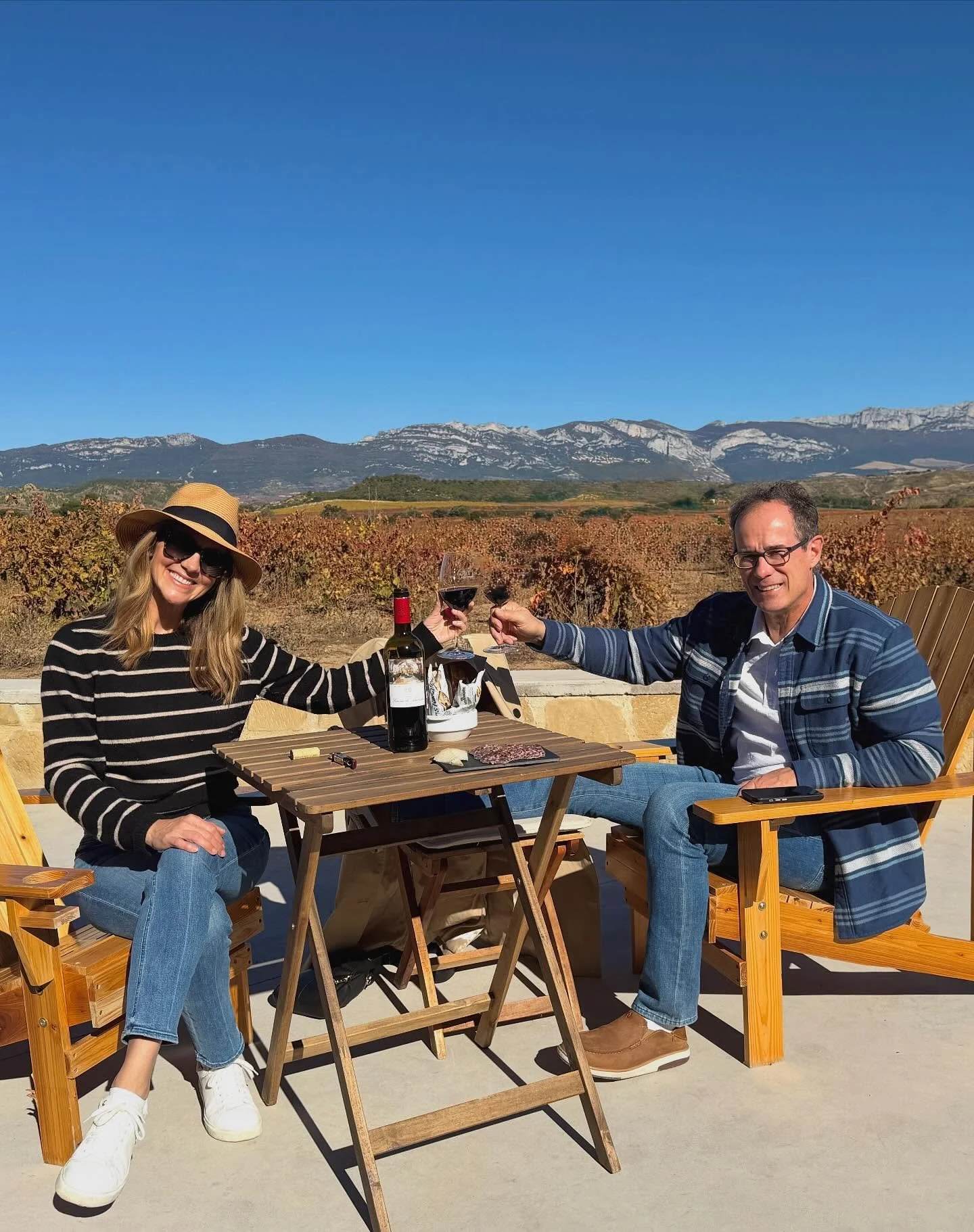 50 in La Rioja 🍷🍷. Drove north of Madrid for 2 days of blue sky, sunshine, wine and fall color. 2nd pic is our reflection at @bodegas.amezola  Loved our hotel @santamariabrioneshotel and had both red pepper and onion ice cream @allegarrestaurant  W