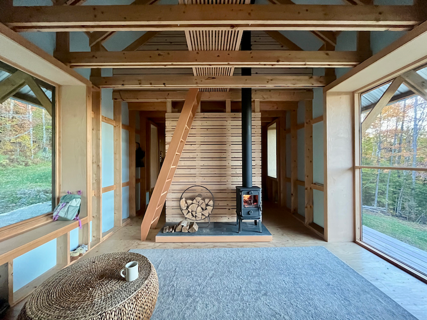 Off-Grid Contemporary Timber Frame Cabin Wood Stove.png