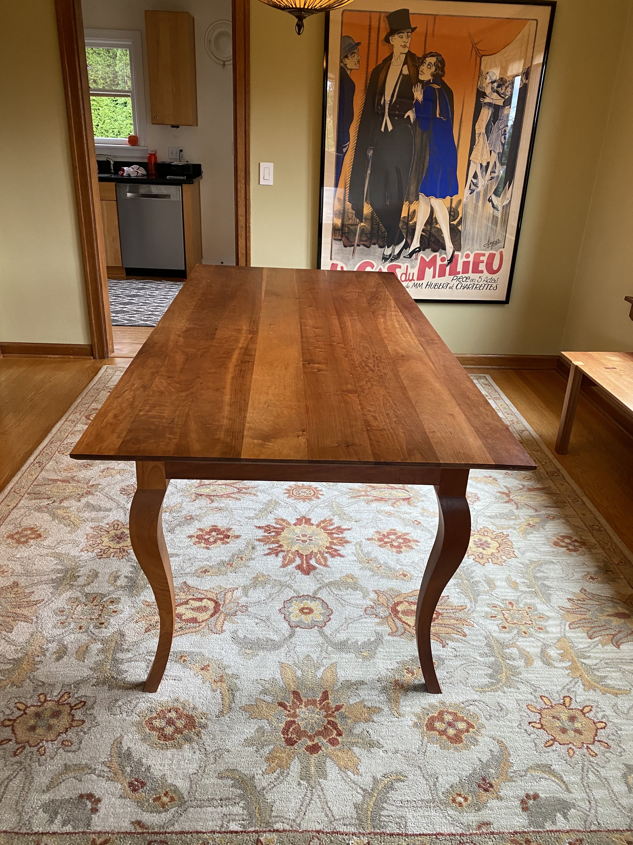 ANNE'S DINING ROOM TABLE, side view | cherry |  features cabriolet legs | surfaces finished in a varnish oil | 80”L x 38.25”W x 30”H