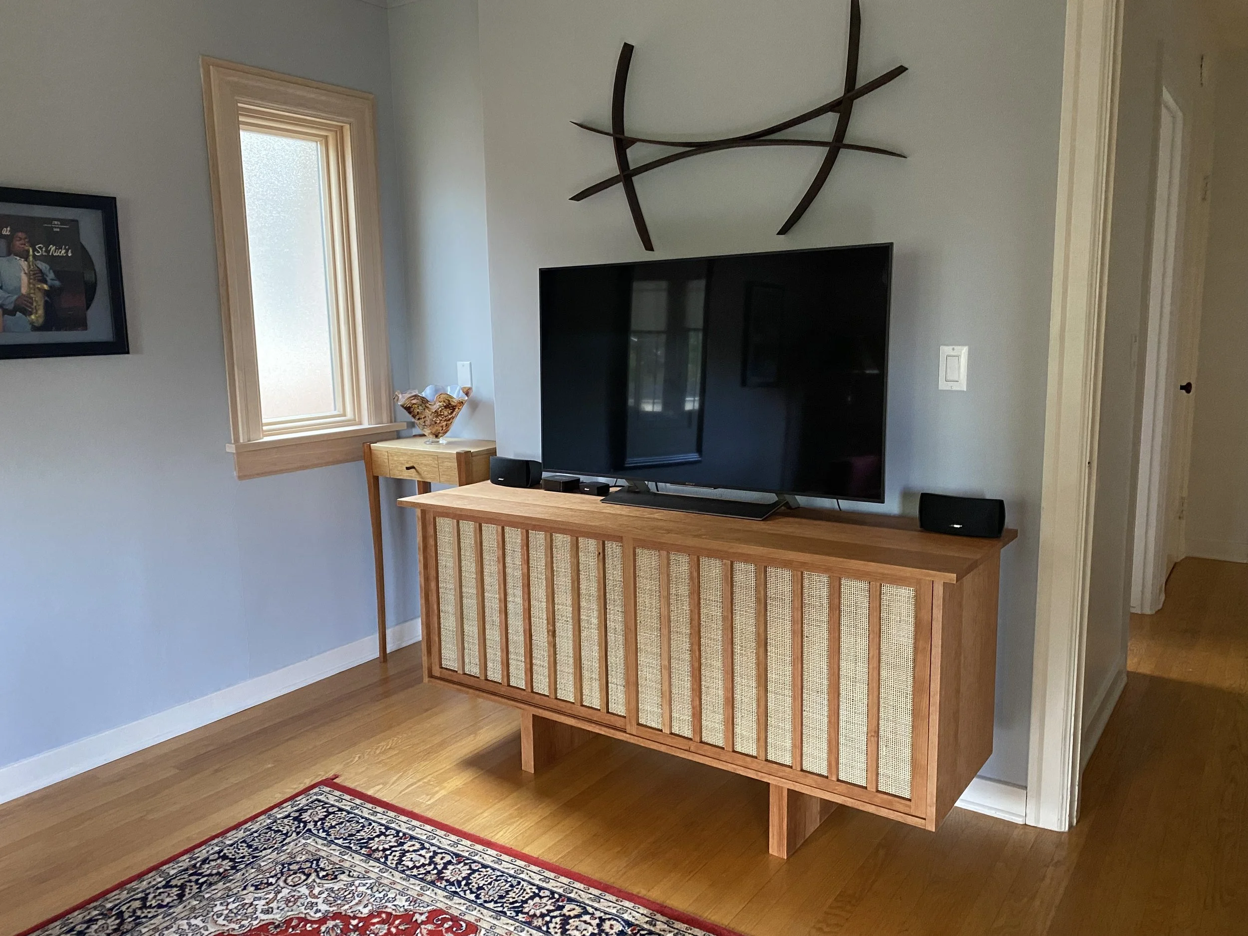 Double sliding door cherry cabinet I Rattan backing on the doors
Dimensions - 65"W x 18"D x 31"H