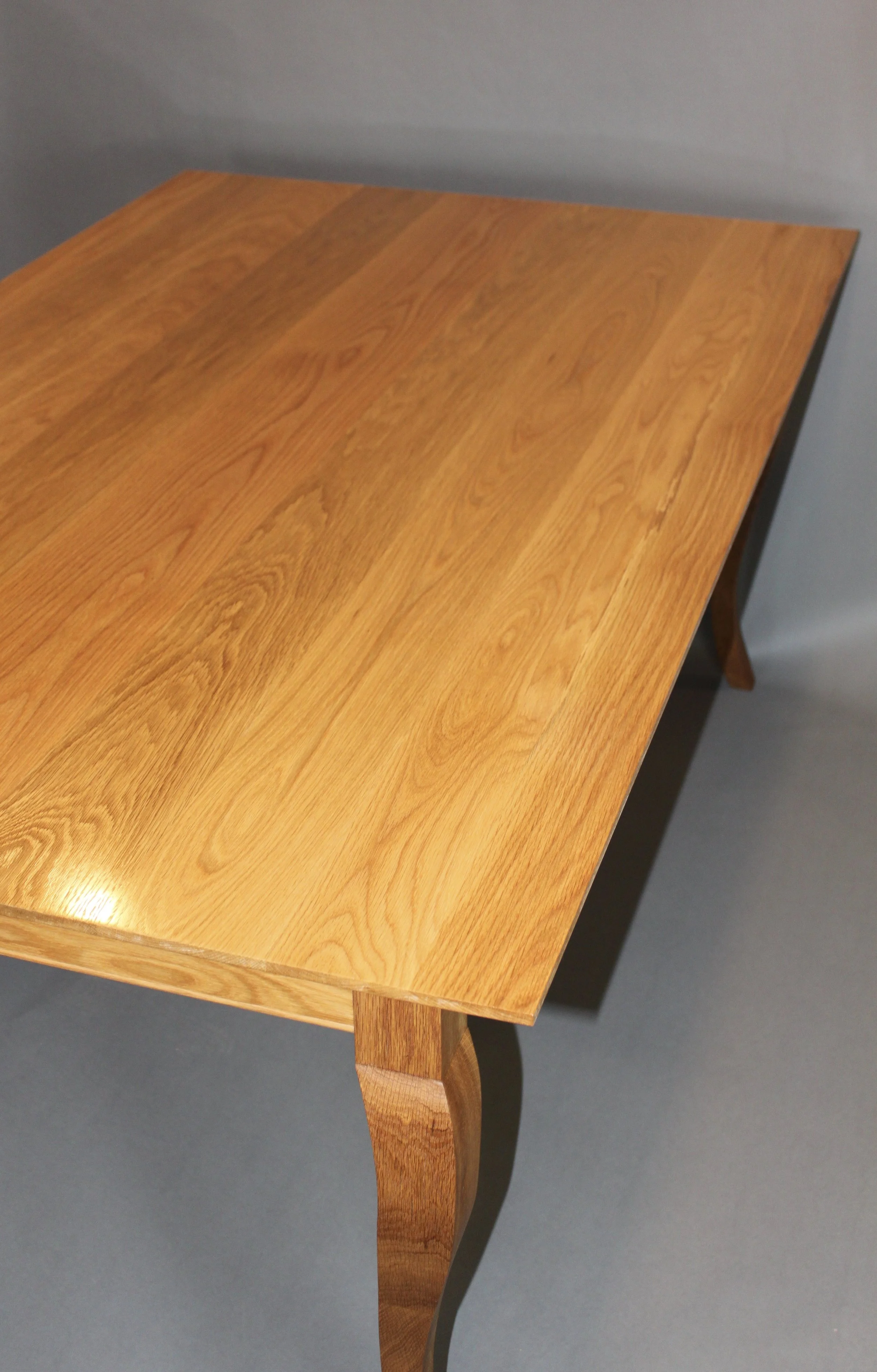 SEGAL-WINTERLING DINING TABLE, top angle view | french country style, white oak with hand sculpted cabriolet legs, finished with gloss varnish | 72"L x 43"W x 30"H