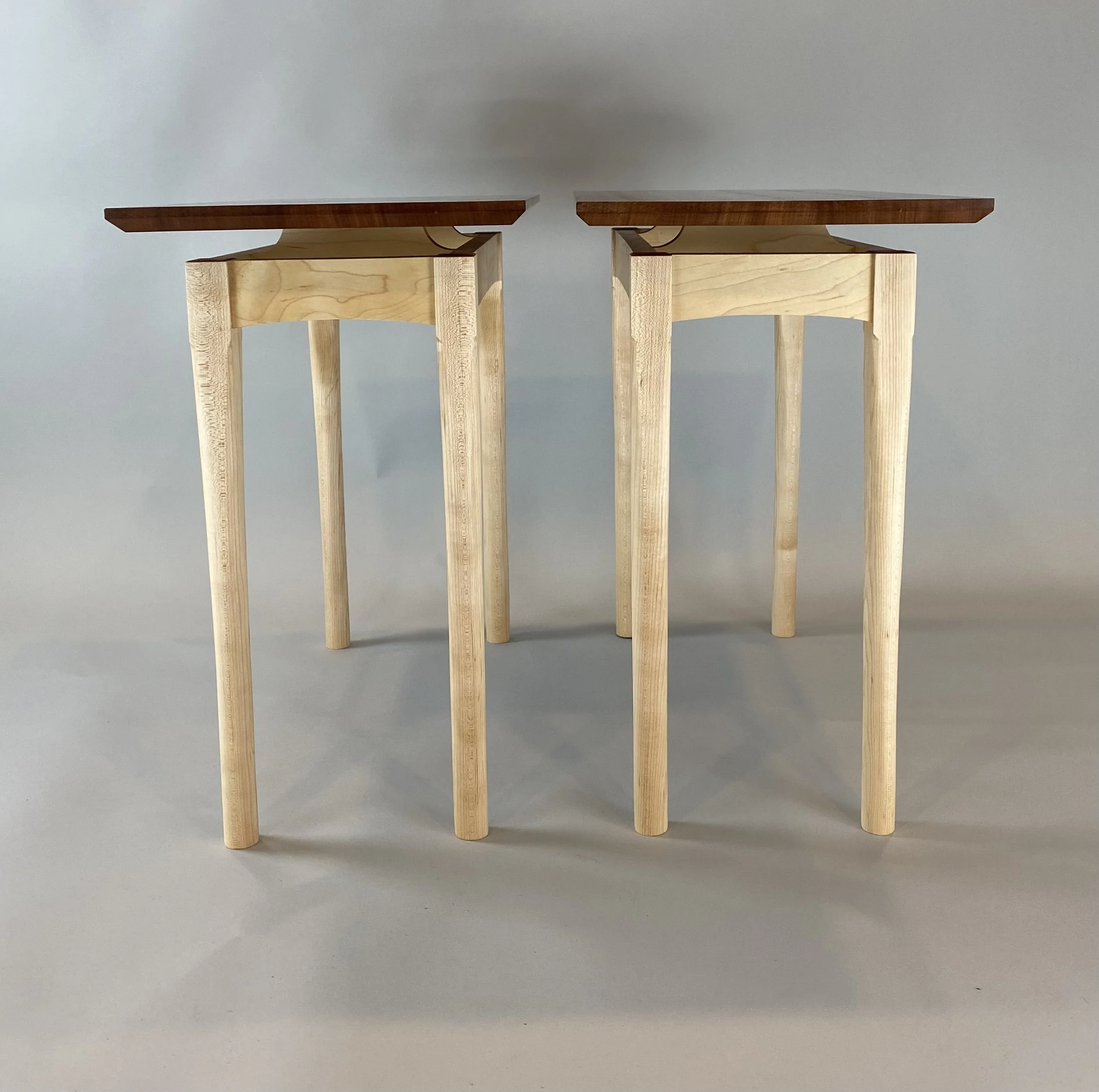 MAPLE SIDE TABLE, front view | set of two maple/makore side tables | legs shaped by hand with a spoke shave & then sanded, base designed to "float" the top | individual table dimensions are 13"W x 24"D x 21.75" H