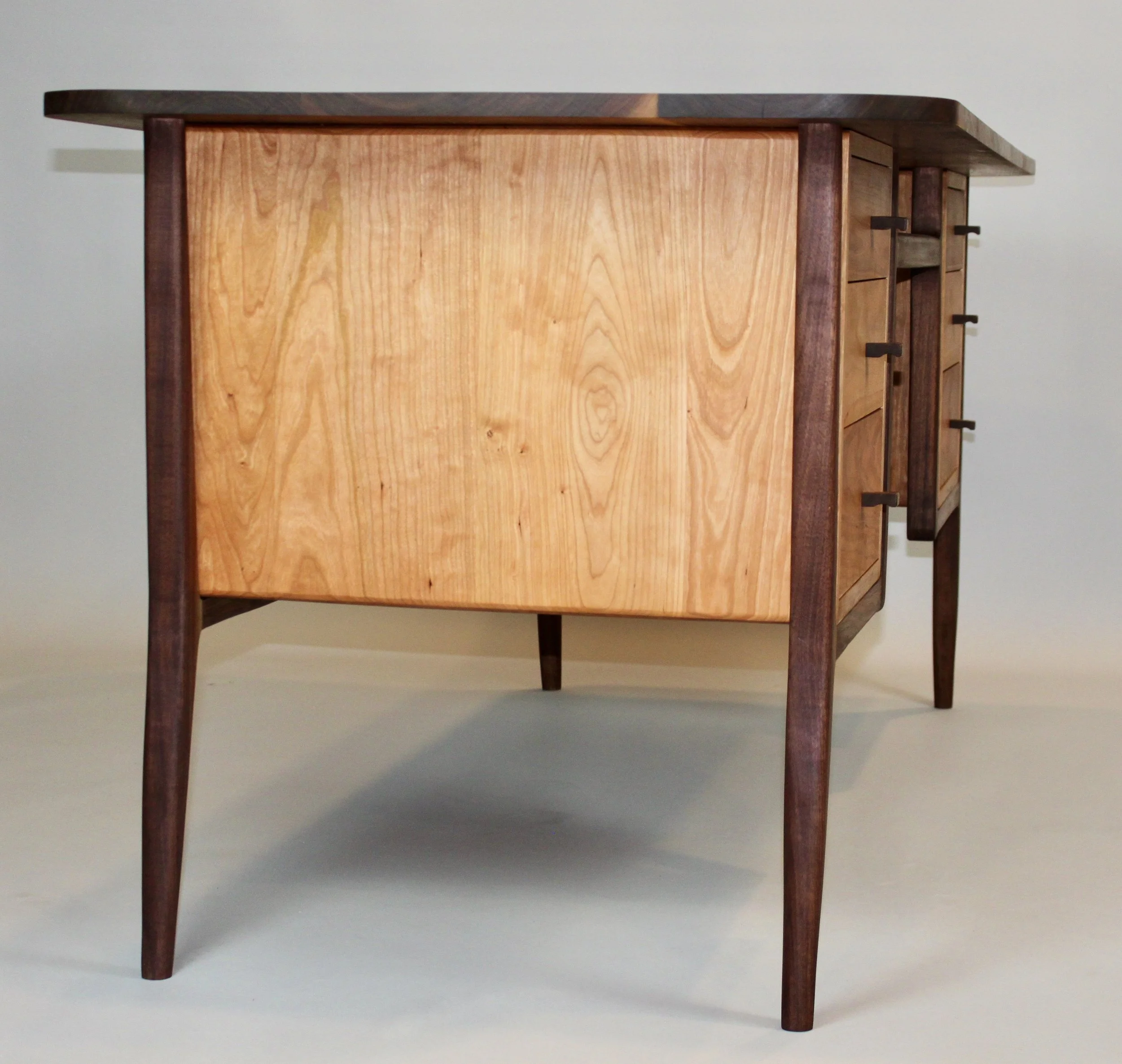 MID-CENTURY MODERN DESK, side view |  walnut frame & top, cherry cases & drawers | 64"W x 30"D x 29.5" H