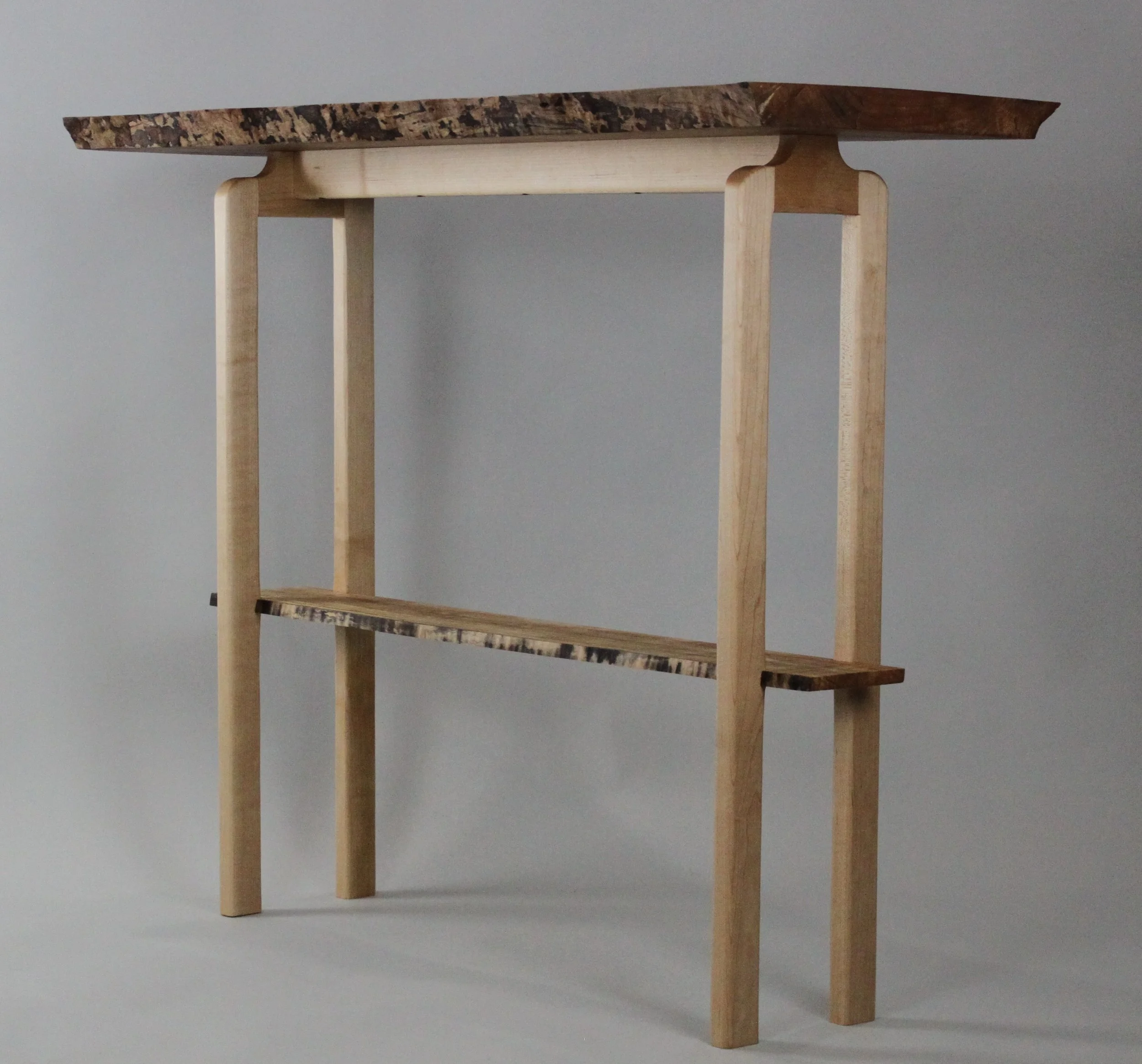 CURLY MAPLE CONSOLE TABLE, side angle view |  live edge curly maple with hard maple base, finished with varnish oil | 30"H x 36"W x 15"D