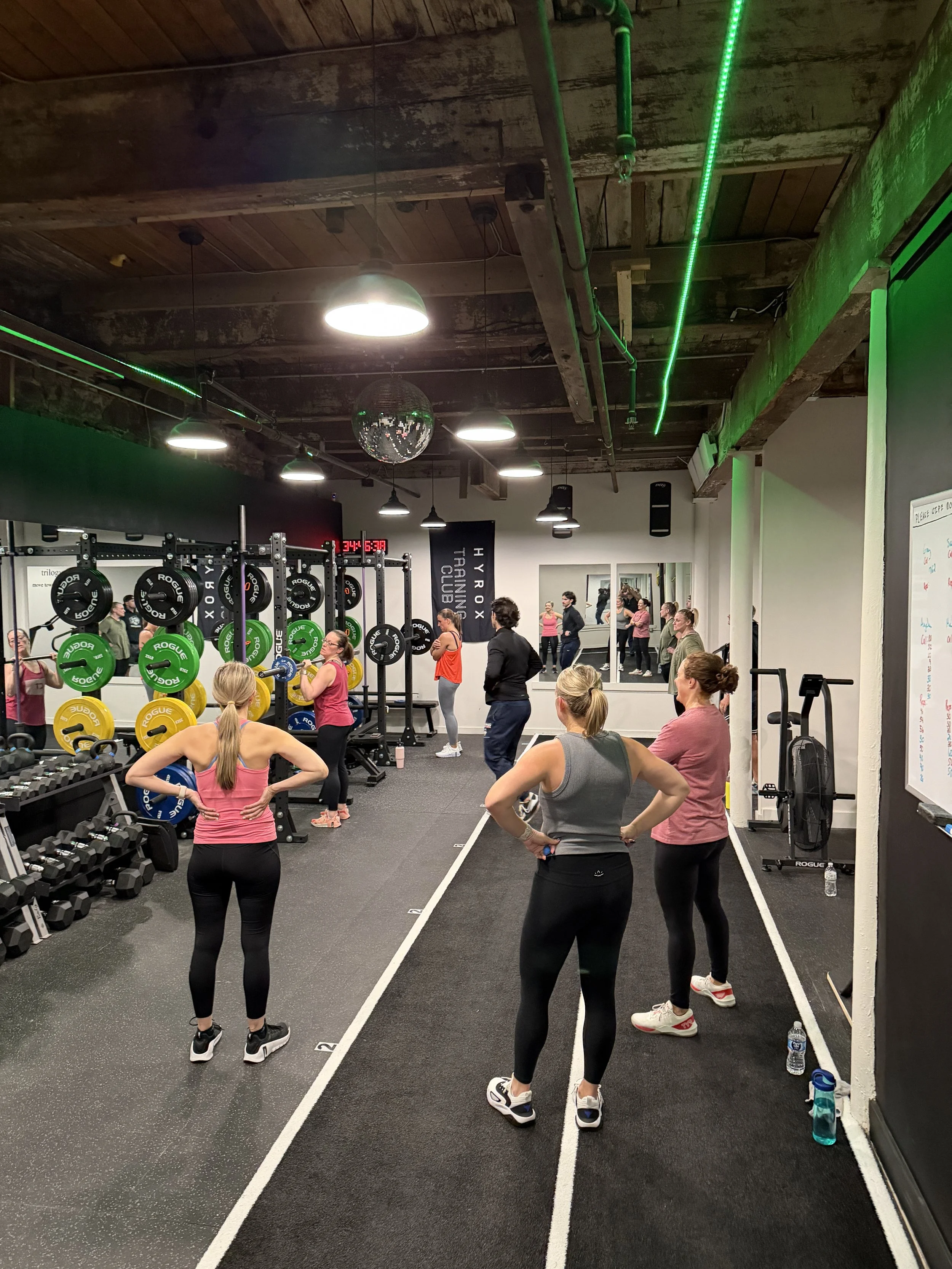 Group fitness class with trilogy trainers doing a strength class in Granby, CT.