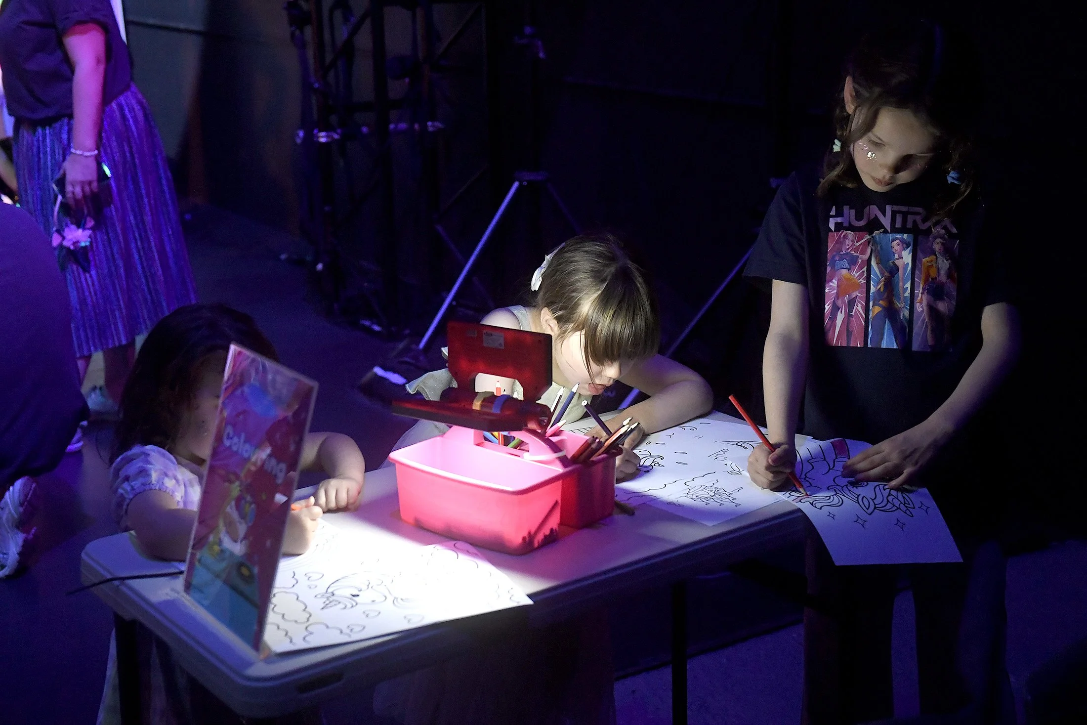 Children colouring at a table at Big Unicorn Dance Party
