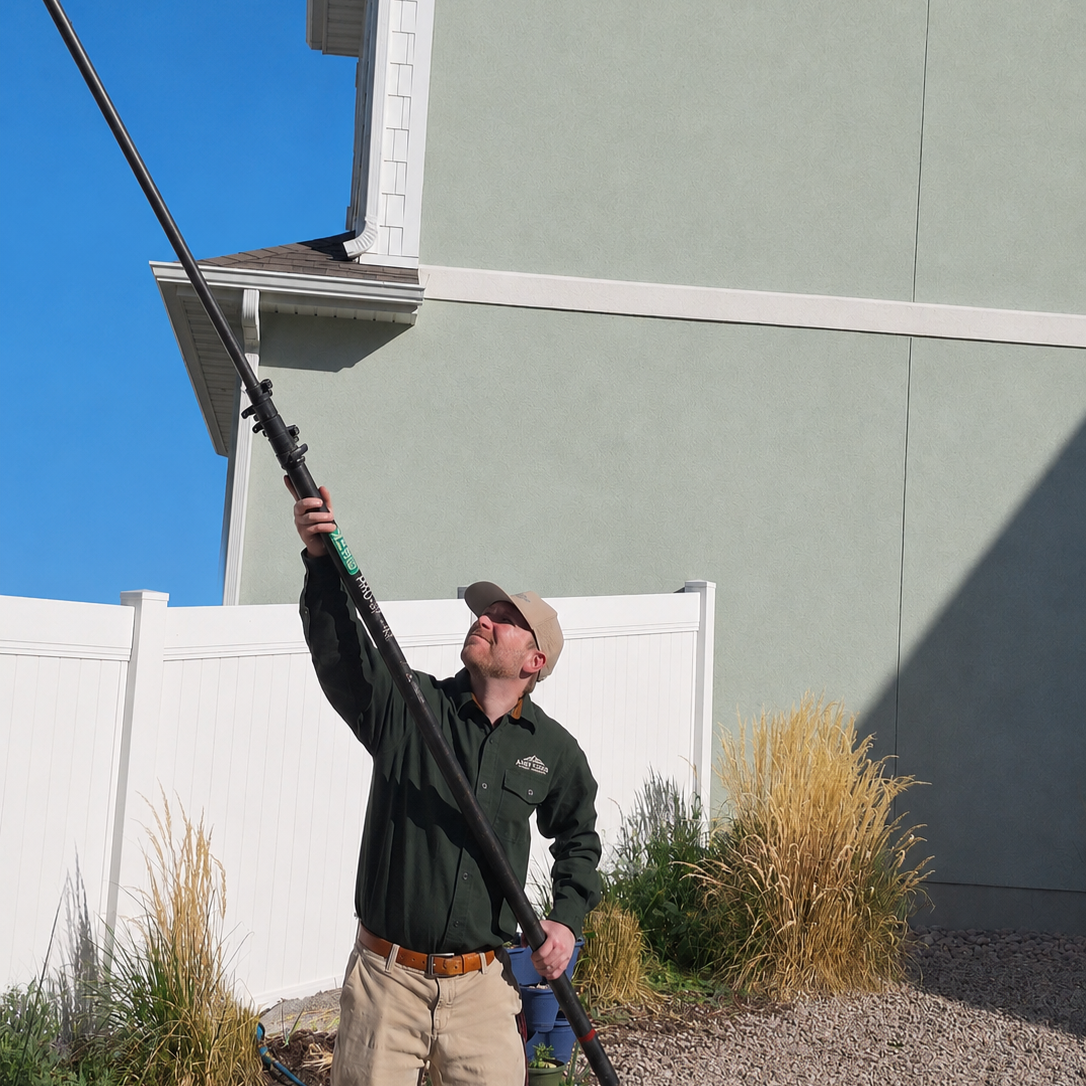 Apex Guard Pest Control wasp prevention service treating eaves and roofline areas on residential property Logan, UT