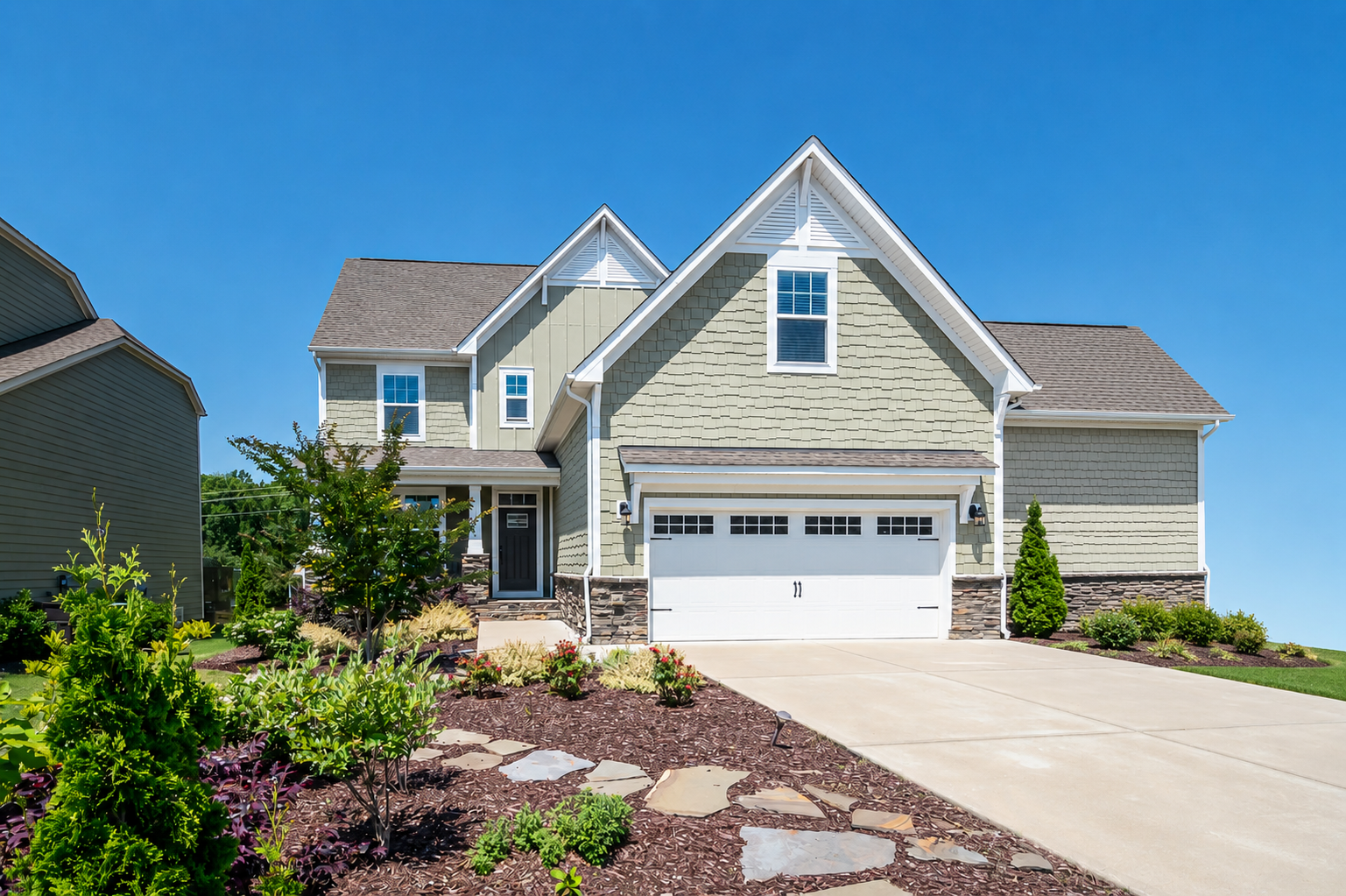Modern suburban home with garage and exterior areas commonly monitored for rodent activity and prevention
