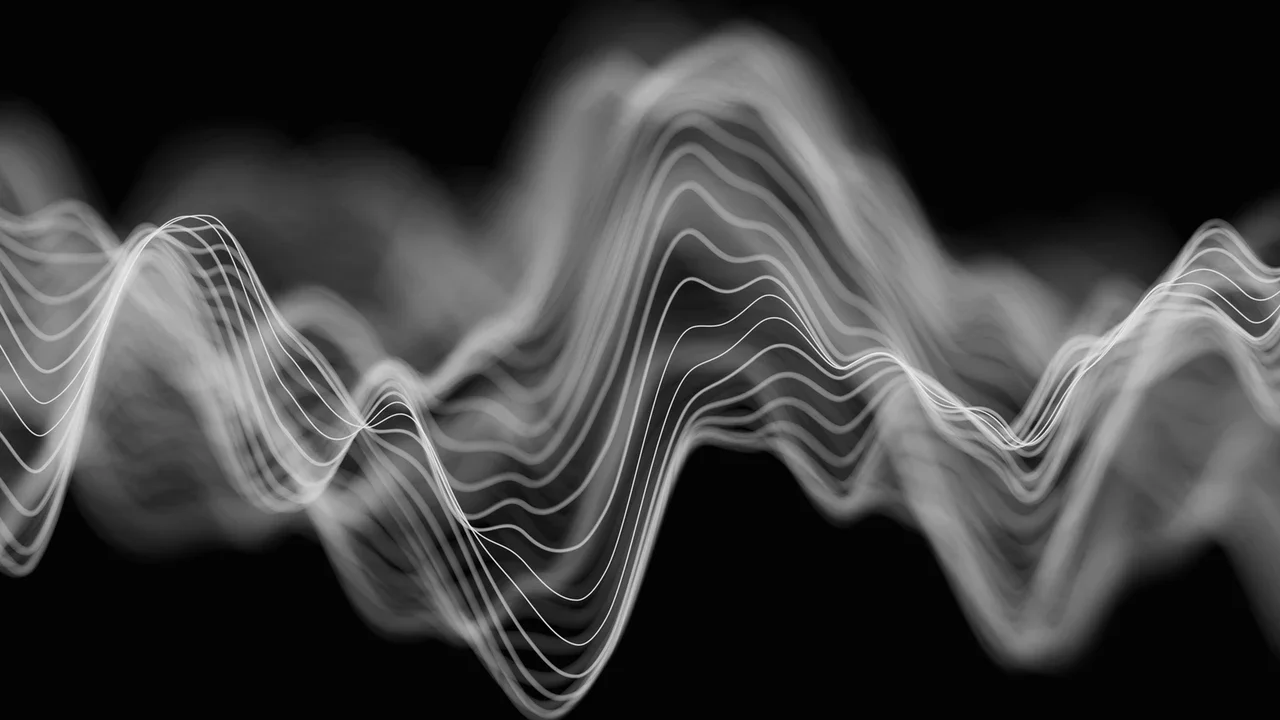 Abstract black and white waveforms or soundwaves on a dark background.