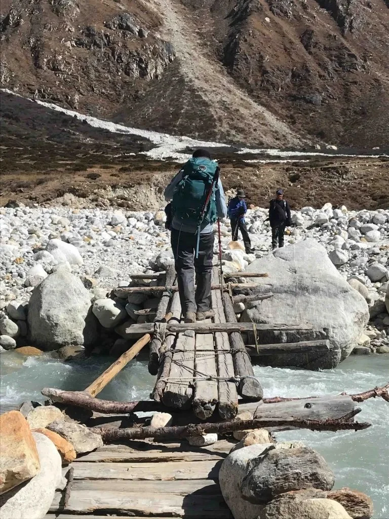 Another interesting wooden bridge over a river - timber logs tied together