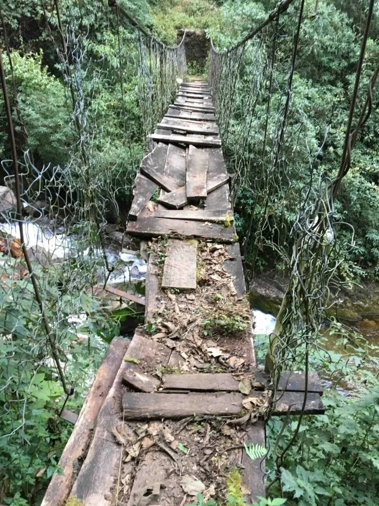 a swingbridge with gaps in the timber slats