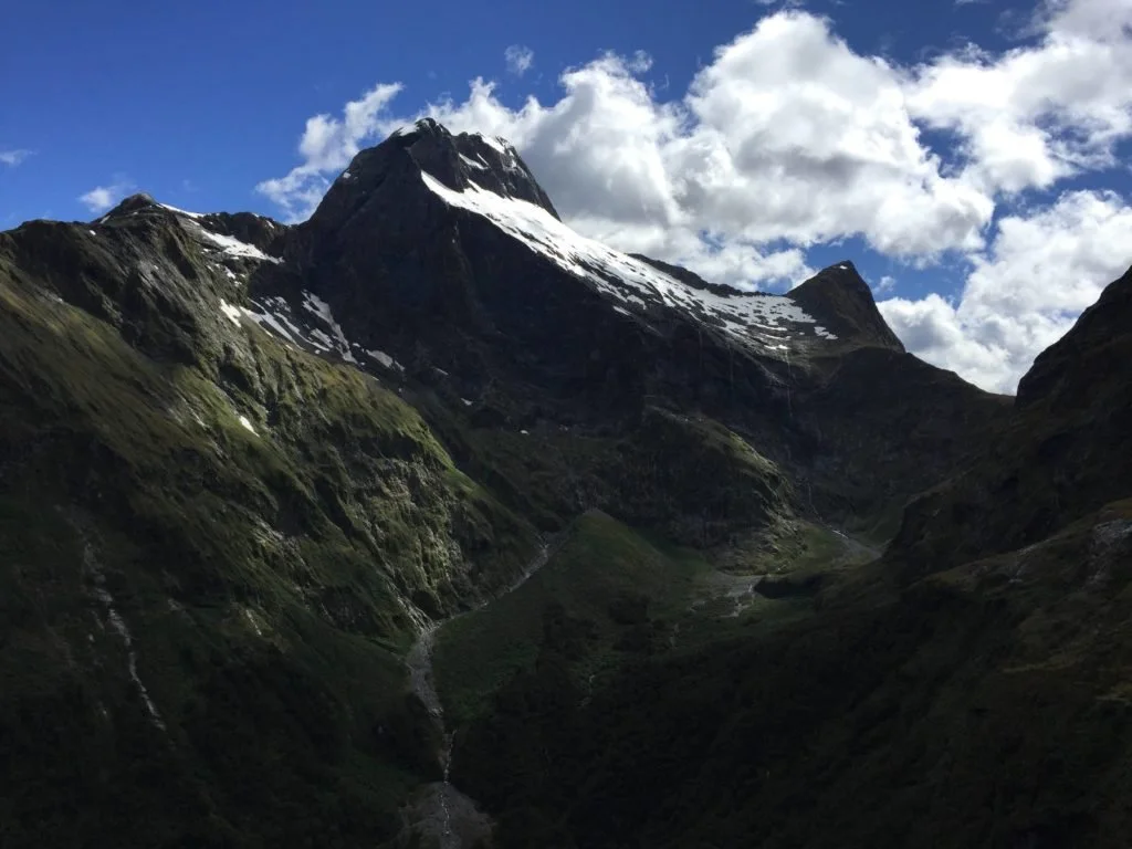 A bit of snow on top of nearby mountains