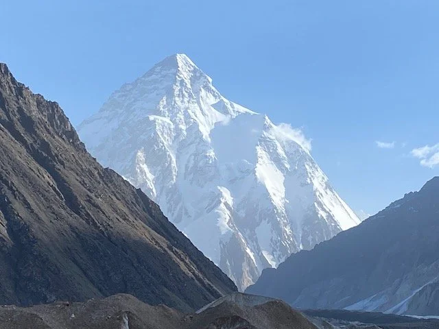 K2 covered in snow with blue sky