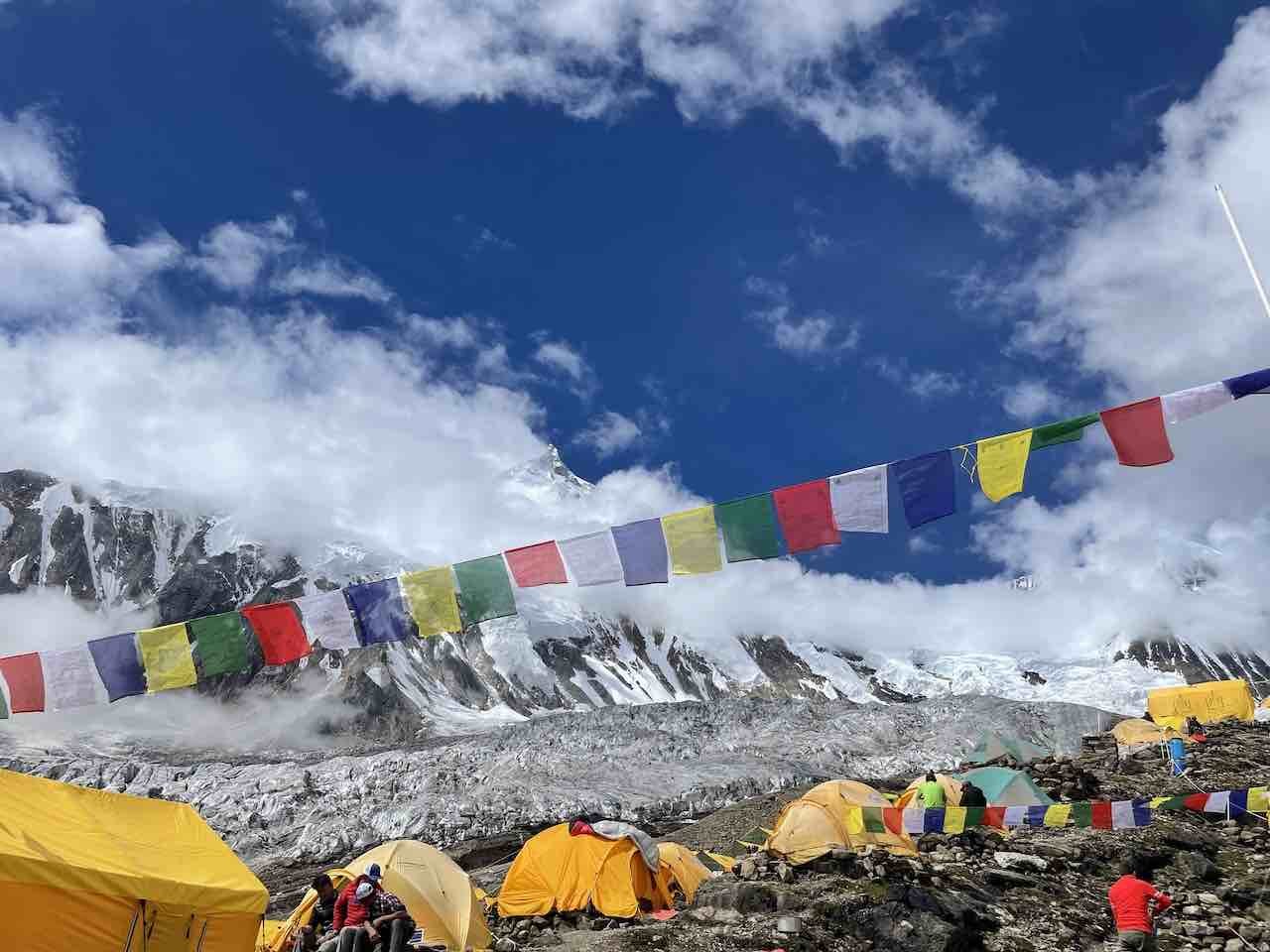 prayer flags flying at manaslu base camp in nepal