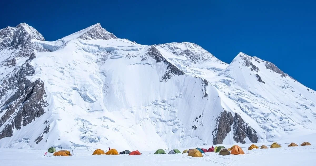 Gasherbrum II with base camp tents in foreground