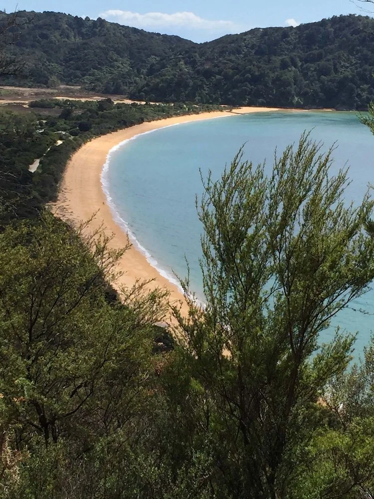 looking down to a beautiful golden beach