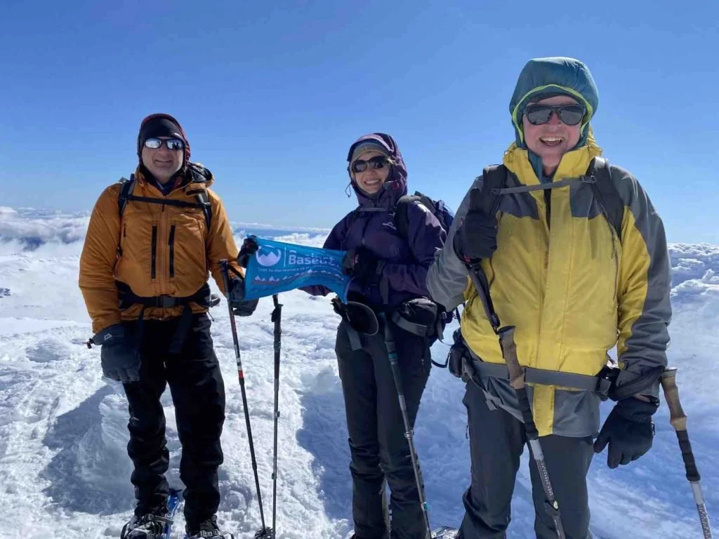 Trevor and Emma on the summit of Mt Kosciuszko with Andrew Lock