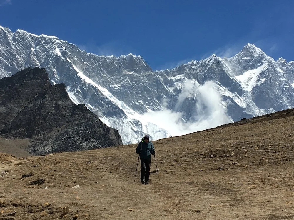 a trekker with huge Himalayan mountain backdrop